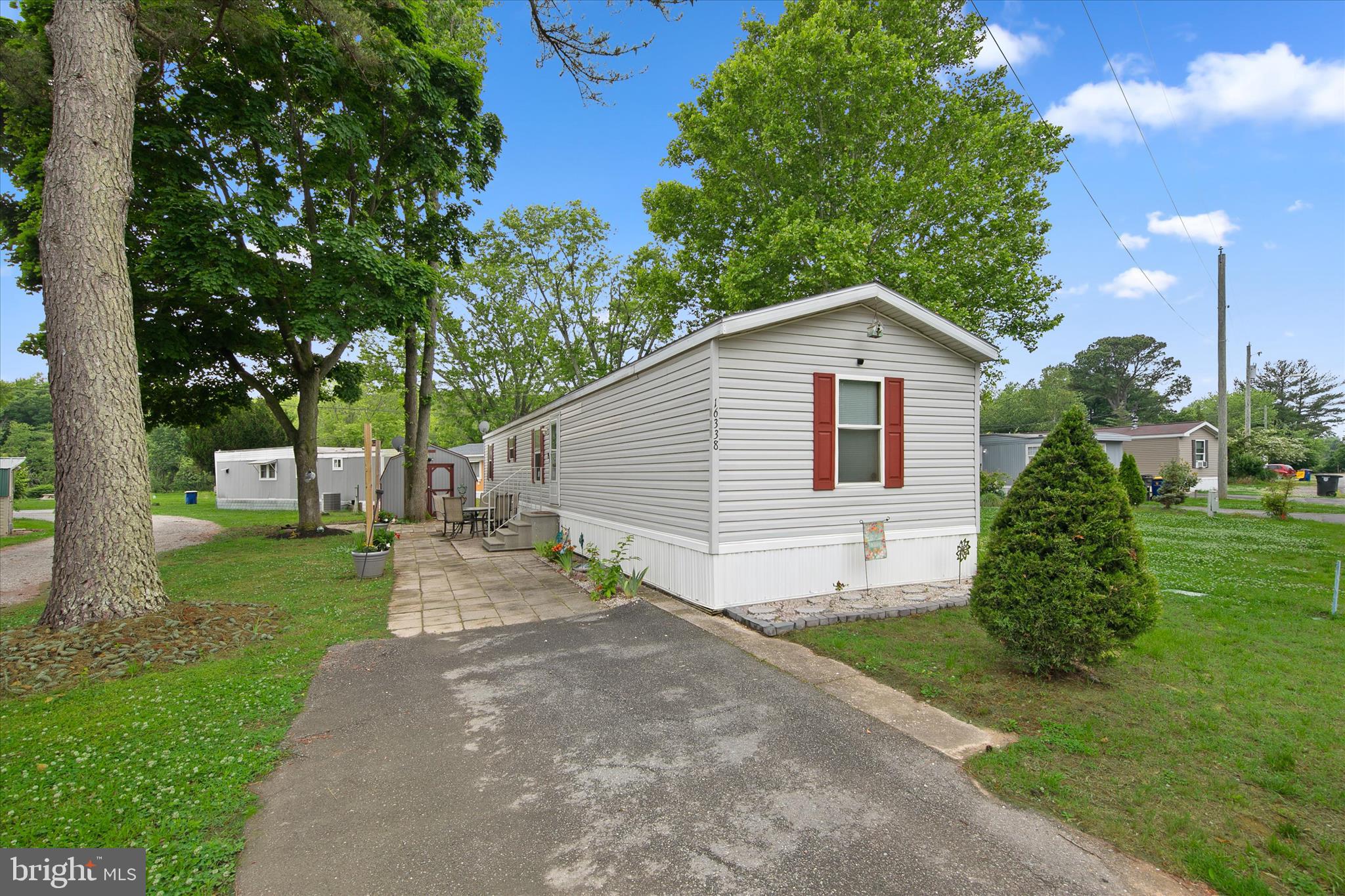 Location is the highlight of this 3-bedroom, 1.5-bath home! Located along the Lewes-Georgetown Trail (great for biking, walking, strolling and running) and just minutes from Historic Downtown Lewes and the beach, you'll love having restaurants, shopping, and outdoor recreation practically at your doorstep. The home features vaulted ceilings, plank flooring throughout most of the home, vinyl flooring in the kitchen, gas cooking, a French-door refrigerator, a patio, and a storage shed. Recent community improvements, including city water, city sewer, and city trash service, have helped transform this well-located neighborhood. Grab breakfast from the nearby Roll 'n Egg food truck, hop on the bike trail, or spend the day at the beach—it's all within easy reach from this convenient Lewes location.