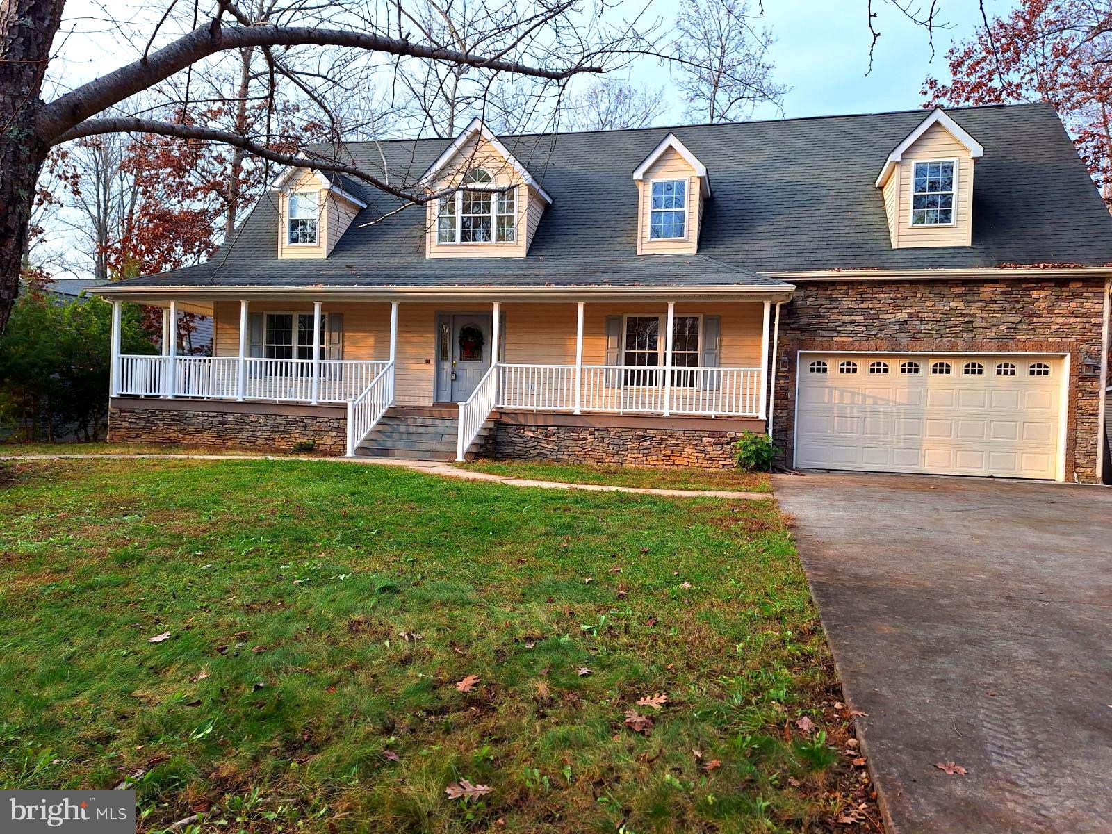 Waterfront Home on the Main Lake at Lake of The Woods! Don't miss out on this lovely 4 bedroom, 3 full, 2 half bath Cape Cod waiting for you to start enjoying everything that this fabulous Lake and Golf Community has to offer. You will love the space and huge back deck overlooking the glistening Lake while having your morning coffee or entertaining the family and friends here at your Oasis! Hardwood floor in the Main Level Primary Bedroom, Beautiful Cathedral Ceiling in the Living room with a wall of windows overlooking the water, Full covered front porch with covered side porch also leading to the back of the home.  In the back, you will find a full length back deck with fabulous waterfront views, below this is a full length patio to enjoy as you come out of the lower level to head to the Lake!
In the basement, you will find new carpeting, a lower level bedroom with waterviews, full bath and a wonderful rec room and spacious storage room!!
Seperate dining room with hardwood flooring just off the kitchen. The Kitchen has lovely waterviews also! As you head upstairs you will find another 2 spacious bedrooms, a full bath and another half bath, all hardwood flooring on the upper level as well.
This home is priced well and is just waiting for your finishing touches to make this your own retreat!
Approximately an  hour from Washington, and about the same for Richmond and Charlottesville make this a fabulous location for a perfect weekend getaway also!
Schedule your tour today and start Living the Lake Life!