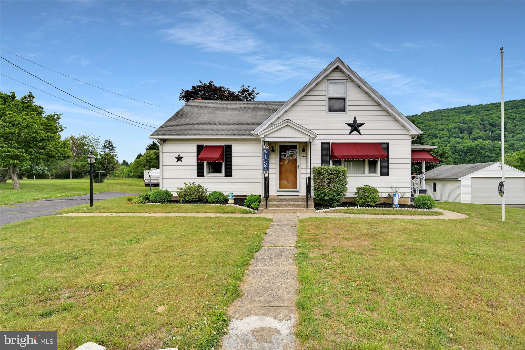 Nestled on a peaceful road in Schuylkill Haven and located in the Blue Mountain School District, this charming bungalow offers endless potential on a beautiful 1-acre lot. Featuring 3 bedrooms, 2 full baths, and original hardwood flooring beneath the carpeting, this home is ready for its next owner to make it their own. The spacious second floor provides an excellent opportunity to create a primary suite or additional living space to suit your needs. The kitchen comes complete with all appliances, making your move even easier. The basement has a nice size workshop for all of your projects! Outside, you'll find plenty of room to enjoy the outdoors with an above-ground pool, a two-car carport, three storage sheds, and abundant off-street parking. The previous rear deck has been removed, leaving the ideal footprint for a new deck or outdoor entertaining area customized to your taste. With just a few cosmetic updates, this property has the potential to truly shine. Don't miss your chance to own a home in a desirable location with space, character, and opportunity. Schedule your private showing today!