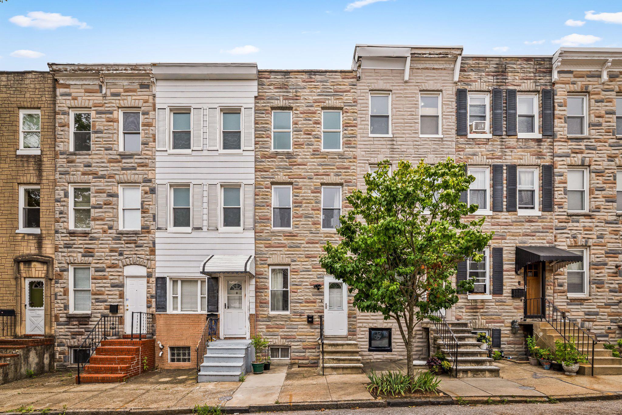 Welcome to the Remington Historic District. This three story stylish home is just steps away from Clavel Mezcal Bar and Taqueria, and the IYKYK speakeasy, W.C. Harlan. Looking for a move-in ready house in walkable Baltimore with no big projects to tackle? You've found it. Entertain easily with easy access to a patio right off the kitchen, or on the spacious backyard patio below. The kitchen is beautifully remodeled, with stainless steel appliances, and white shaker cabinetry. All the carpet was replaced within this year, and the house was just fully repainted a warm and neautral designer white with on-trend accent walls. The bathroom will definitely wow you, with a huge walk in closet or dressing area with plenty of storage. The enitire home is filled with light, and is neat as a pin. Don't worry about any big house projects to tackle - the owners have taken care of the big stuff - like new plumbing, water main, and pressure valve. A new HVAC motor was replaced in 2021, as well as the asphalt roof lining. Even the elctrical was replaced this year as well. Come live your best urban Remington lifestyle on this quiet and homey block. Welcome home.