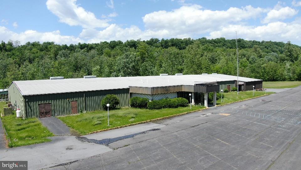 Discover a rare chance to own a one-of-a-kind property with endless potential. Once a bustling Moose Lodge, this 12-acre estate combines indoor and outdoor amenities perfect for transforming into a thriving event center, restaurant, brewery, retreat, or entertainment venue.

Property Highlights:
Expansive Indoor Space with multiple gathering areas

Two full-service bars for seamless beverage service

Commercial-grade kitchen with multiple walk-in freezers & storage

6-lane bowling alley – a built-in entertainment attraction

Outdoor amenities including pavilions, horseshoe pits, and a large BBQ pit designed for chicken roasts and large gatherings

Parking for 250+ vehicles – ready for concerts, festivals, and weddings

12 acres of open land – offering privacy, expansion opportunities, or outdoor event space

Why It Stands Out:
This property isn’t just a building — it’s a canvas for your vision. Whether you’re looking to open a destination brewery, host weddings and retreats, create a multi-purpose recreational venue, or develop a private club, the infrastructure is already here to launch your dream.

📍 Conveniently located with easy access to main roads, yet offering a private and spacious setting.

✨ Endless Possibilities – Bring Your Vision to Life!
Schedule a private showing today and explore how this unique property can become your next big venture.
