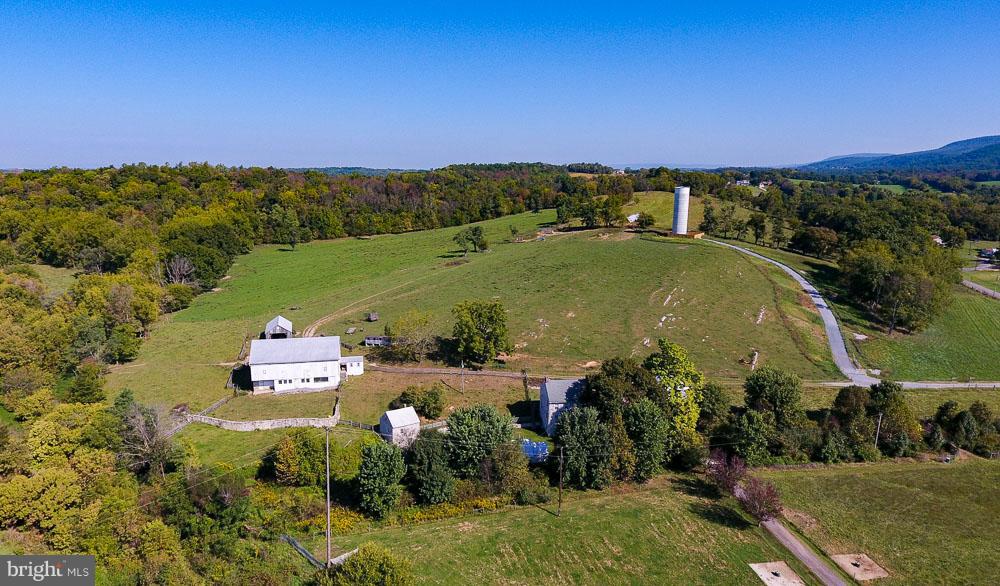 BEAVER CREEK AREA - 172 ACRE FARM, LIMESTONE COLONIAL FARMHOUSE, 9' CEILINGS & 4 FIREPLACES, SPRING HOUSE W/LOFT & FP, SMOKE HOUSE WITH FP, BANK BARN, OUTBLDGS & STREAM,  RE-POINTED STONE, NEW CONCRETE BRIDGE, ORIG FLOORS/DOORS/WINDOWS, FULL ATTIC & WALK-OUT LOWER LEVEL. APPROX 120 ACRES IN CROP/PASTURE, 50 ACRES WOODED...HUNTER'S DELIGHT. SOME SUBDIVISION POTENTIAL, GORGEOUS VIEWS. THIS IS A GEM!