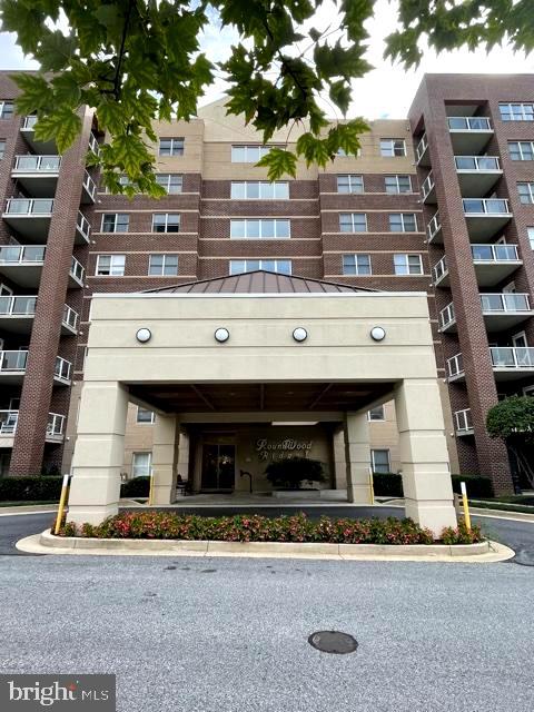 Welcome to your new home in the sought out Roundwood Ridge Community of Mays Chapel.  Enter through security locked doors and into the elegantly designed and beautifully maintained lobby.  Or enter through the garage and take elevators directly up to your floor or to the common areas that are perfect for entertaining or social gatherings.   The building also offers, for your convenience, a beautiful little mail room with packaging station.   Your new condo has been professionally painted, cleaned, and ready for you to move in and enjoy.  This condo has been meticulously maintained, and is quite lovely, with 2 graciously sized bedrooms and 2 full baths, full laundry, and a kitchen with all new stainless appliances and double sink. The dining room could also be used as your office or den. The balcony, off the family room, has a great woodland view. On cool or chilly nights, flick on the switch to your fireplace, and enjoy the warmth.  There is extra storage on the 6th floor, plenty of parking around this building, and all maintenance outside of your condo is taken care of.  Walking and jogging trails provide opportunities to walk to Groul’s Grocery and other local shopping, restaurants and parks. This is truly a wonderful place to call home!