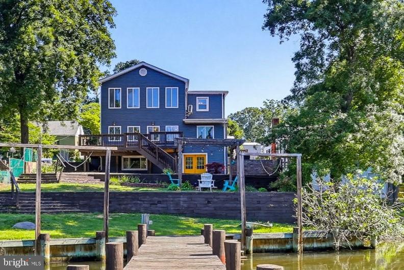 Your waterfront home awaits in sought-after Chelsea Beach on the Magothy River! Enjoy panoramic views from your tiered flat yard only a few steps above the water's edge. You'll find bedrooms with a direct water view on both levels along with lots of upgrades and custom features. The full unfinished basement is perfect for storage and a workshop. Relaxing or entertaining will be easy with the fabulous deck, fire pit and patio. In addition to your private dock, the community boat ramp is only a few hundred yards away on your side of the creek. Community will be easy with quick access to Rt. 100 (no Mountain Road gridlock). Don't miss this terrific opportunity. Contact us or your agent for a private tour!