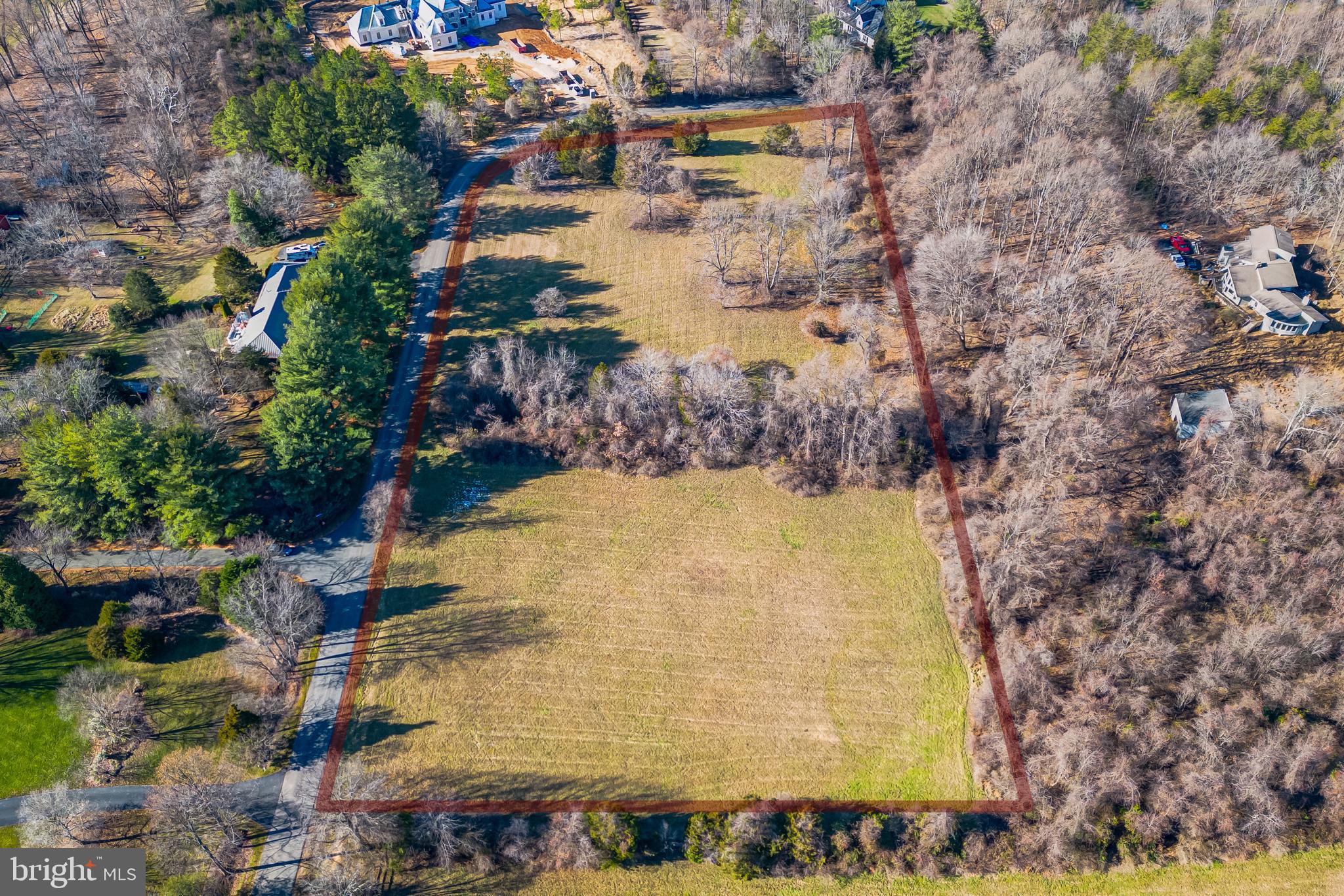 This rare find of beautiful flat, over five acres of land, where you can imagine your dream home. Surrounded by woods and beautiful homes, this property is nestled in the exclusive Woodsfield neighborhood of Great Falls, in the sought-after school district of Langley High School, ranked one of the highest in the United States. Be immersed in the natural beauty of the Virginia countryside while only minutes away from Tyson’s corner and Washington, DC.