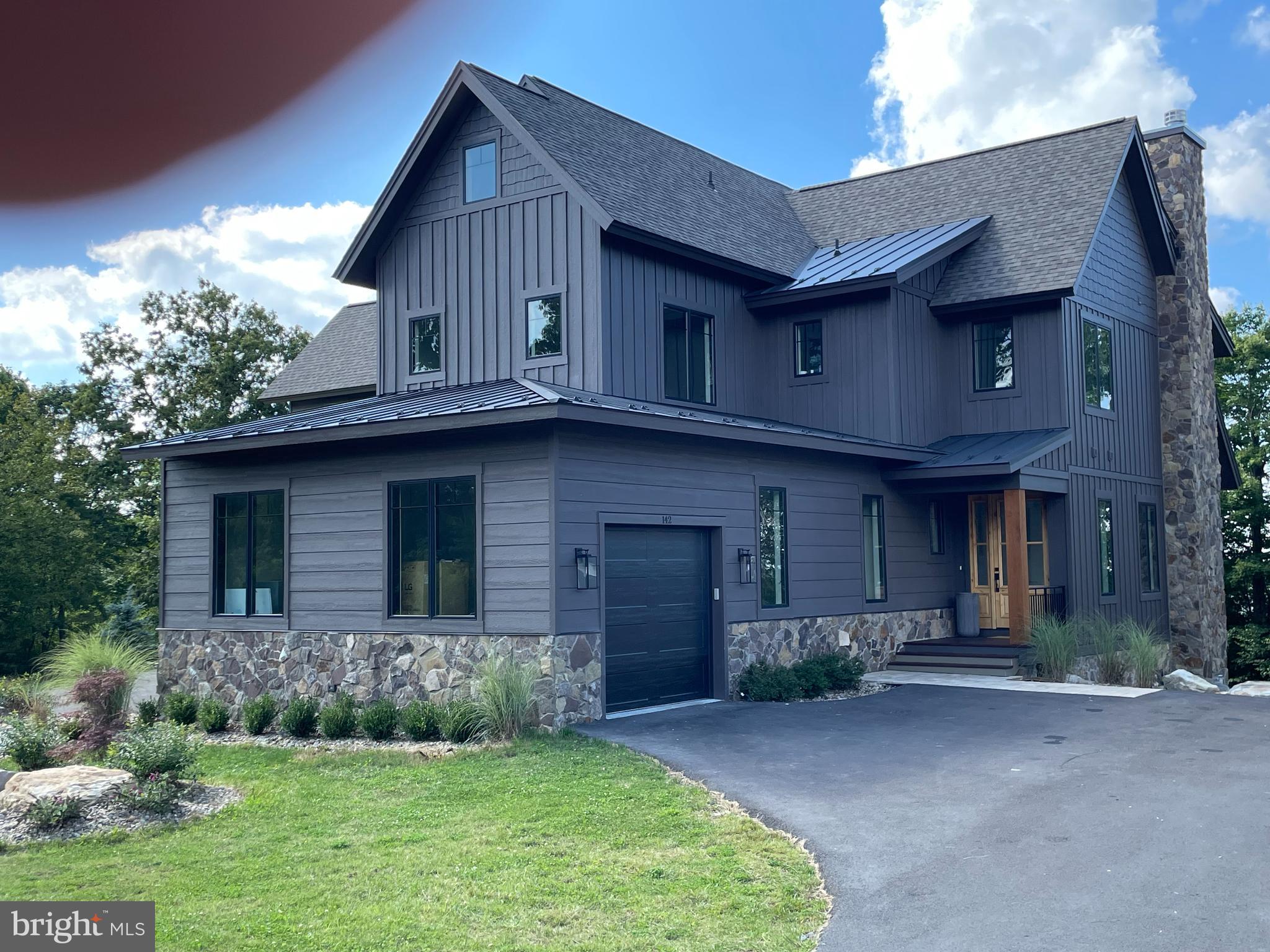 SIGNIFICANT PRICE REDUCTION. Someone is going to get a great deal on this beautiful home !!  Stunning Mountaintop Ski-In/Ski-Out Luxury Home in the Ridge Run Community on
Wisp Mountain.
Experience the pinnacle of mountain living in this extraordinary, professionally designed
and decorated home with approximately 5,500 finished sqft, where every detail is crafted to delight. The gourmet kitchen is a
culinary dream, featuring high-end appliances, marble countertops, and ample
workspace-perfect for both everyday meals and memorable gatherings. Entertainment
abounds with a private indoor basketball court, a luxurious hot tub for relaxation, and
multiple fireplaces-wood burning and gas-for cozy evenings. Challenge friends and
family to a game of pool or gather in the private movie theater for a cinematic
experience. Step outside to enjoy the fresh mountain air while roasting s’mores over the
outdoor fire pit, sharing stories that will become treasured memories. Whether savoring
a cup of hot cocoa by the fire or exploring all that Deep Creek Lake has to offer, this
home promises a luxurious retreat like no other. Indulge in a residence that redefines
elegance and comfort-a place where every moment is an experience and every stay is
unforgettable.
Discover luxury living at its finest in this stunning, three-level home featuring an open
floor plan, top-of-the-line finishes, and an abundance of natural light that seamlessly
connects indoor and outdoor living. Nestled atop Wisp Mountain in the highly soughtafter
Ridge Run Community, this residence offers unparalleled convenience-just steps
from Chairlift #7, granting you effortless ski-in/ski-out access. Despite its serene
mountaintop setting, the home is only minutes from Deep Creek Lake, ensuring you’re
close to boating, whitewater rafting, dining, and year-round recreation. Every corner of
this immaculate home is thoughtfully designed, with designer furnishings and tasteful
decor creating an atmosphere of refined elegance throughout. The views here are
simply breathtaking, no matter the season.  Don’t miss the opportunity to own this exceptional property where every detail reflects quality, comfort, and timeless mountain charm.
Being Sold Turnkey with Top-of-the-Line accoutrements $10,000 Custom Kitchen Range, Hand-Built in Italy 
Solid Brass Interior Door Handles and  Bathroom/Kitchen Fixtures 
Over $200K in Rental Income in 18 months  All Solid Wood Handmade Custom Vanities with Solid Marble/Stone Tops  Solid Wood Handmade Custom Entryway Locker System ,Solid Wood Handmade Built in Bunkbeds with Solid Brass Accents ,2 Full Size Sets of Washer/Dryer ,2 Dishwashers ,Custom Build Appliance Garage in Kitchen, All High-End Custom Lighting including Restoration Hardware, Visual Comfort, Curry & Co. $15K Special Order Restoration Hardware , Dining Table Custom Tilework Throughout all Bathrooms including, Cle Special Order Zellige Tile, $22K Custom Kravet Sectional Sofa, In Home Movie Theater with Power Recliner Chairs, In Home Half Basketball Court with Custom Wall Mural, Solid Wood White Oak Floors Throughout.