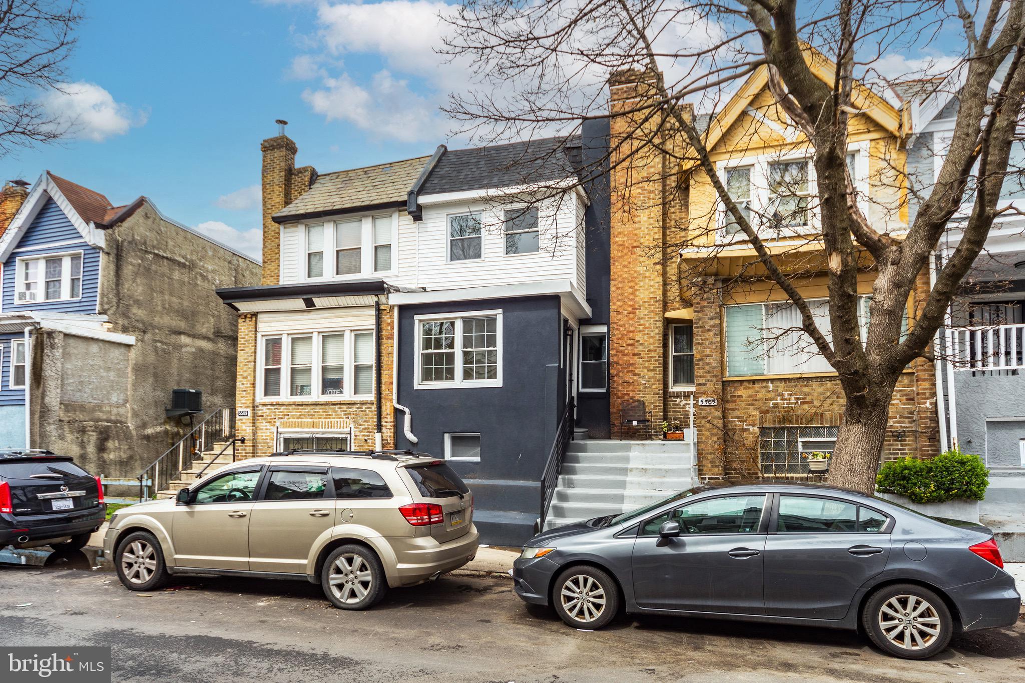 Welcome to this beautifully renovated spacious 3 bedroom, 1.5 bath home located in the Cobbs Creek area of Philadelphia. This home features a bright and airy open floor plan with recessed lighting and modern finishes throughout which include an enclosed front porch providing additional living space perfect for a sitting are or play room. The brand new kitchen offers stainless steel appliances including refrigerator, microwave, stove and dishwasher, the kitchen also flows seamlessly into the living and dining area, perfect for entertaining, all 3 bedrooms offer a ceiling fan. The finished basement includes a powder room and additional living space ideal for a family room, office or gym. Major upgrades include updated plumbing, electric, roof, and heating system offering peace of mind for years to come. Rear parking adds convenience in this desirable location. Move-in ready and close to parks, transportation, shopping center city and Philadelphia Airport.