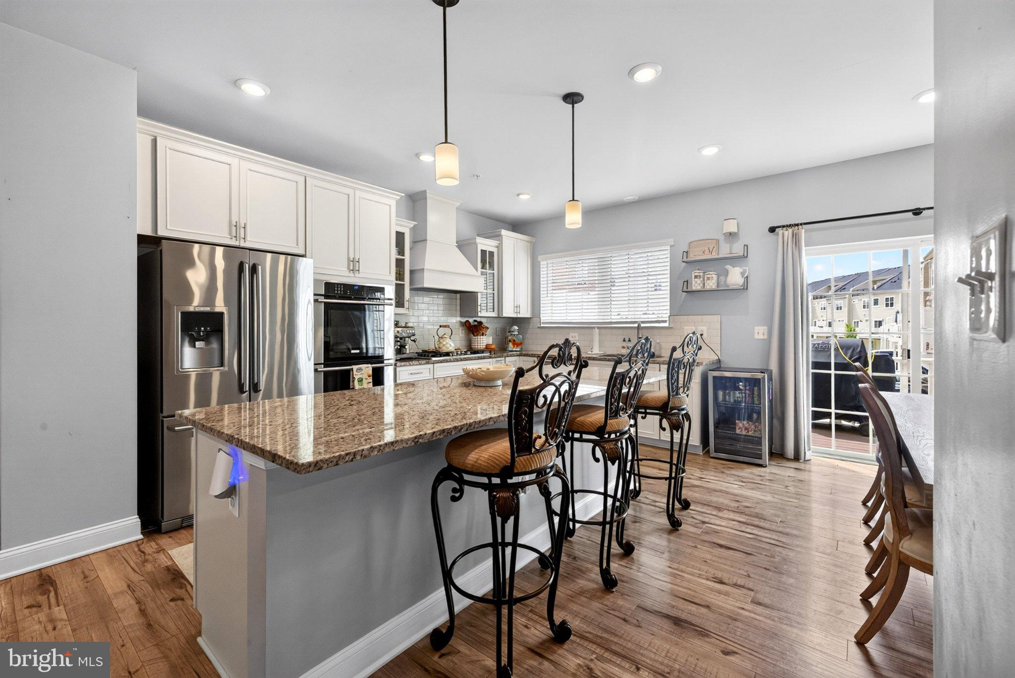 Discover an exquisite blend of luxury and comfort in this stunning 5-bedroom, 3.5-bathroom townhouse nestled in the prestigious Oxford Square community. This residence, built in 2021, showcases a harmonious fusion of Colonial and Contemporary architectural styles, offering a sophisticated living experience that is both inviting and elegant. Step inside to find an expansive 2,410 square feet of meticulously designed living space, where every detail has been thoughtfully curated. Enjoy the convenience of an eat-in kitchen and a breakfast area bathed in natural light, perfect for casual dining. The interior features are nothing short of exceptional, boasting luxurious finishes such as ceramic tile, luxury vinyl plank, and plush carpeting. Recessed lighting and built-ins enhance the ambiance, while window treatments and energy-efficient double-pane windows ensure privacy and comfort. The main level includes an entry-level bedroom, providing flexibility for guests or a home office. Retreat to the master suite, where tranquility reigns supreme. The en-suite bathroom features a walk-in shower and a tub shower, offering a spa-like experience at home. Additional bedrooms are generously sized, ensuring ample space for relaxation and personalization. Outside, the property is complemented by two decks, perfect for al fresco dining or morning coffee. The community amenities elevate the lifestyle further, featuring a clubhouse, fitness center, outdoor swimming pool, and sports facilities including tennis courts and soccer fields. Enjoy leisurely strolls along the jog/walk paths or host gatherings in the picnic area, all within the beautifully maintained common grounds. Parking is a breeze with a rear-entry garage and additional driveway space, ensuring convenience for you and your guests. Located in a serene suburban setting, this home offers easy access to local attractions while providing a peaceful retreat from the hustle and bustle. Experience the pinnacle of luxury living in this exceptional townhouse, where every moment is an opportunity to indulge in a lifestyle of comfort, elegance, and community. Don't miss your chance to make this dream home your reality!