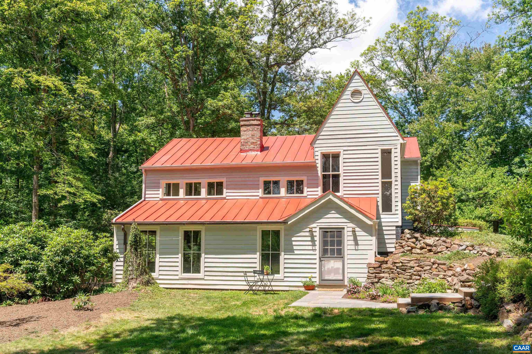 Nestled on 17+ pastoral acres in Southern Albemarle, Down Branch Farm offers an exceptional farmette just 15 mins from downtown & UVA. Masterfully built in 1984 w/ reclaimed materials - heart pine, slate, soapstone, wainscoting & brick - all from local historic homes & businesses. Current owners have honored the custom quality, warmth & soul of this one-of-a-kind home while adding practical & luxurious elements throughout. Highlights include - firefly internet, all new septic, new stunning primary bath, new wood stove & gas fireplace (both w/ new liners), new Wolf double ovens, Wolf 6 burner gas range, Miele DW, new windows (living, dining, kitchen, bedroom), upstairs bedroom reno, interior, exterior & roof painted, new landscaping, bluestone hardscape & high-end lighting / plumbing fixtures throughout. Fabulous kitchen features Buckingham slate counters & Sub-Zero refrigerator AND freezer. Multiple outbuildings, including a 2,100 sq. ft. barn & log cabin, provide function, character & a memorable backdrop for daily living & entertaining. The land is open & level w/ a canopy of mature hardwoods framing the long views. The remarkably private & tranquil setting make you forget you're minutes from all Charlottesville has to offer!,Painted Cabinets,Wood Cabinets,Fireplace in Living Room