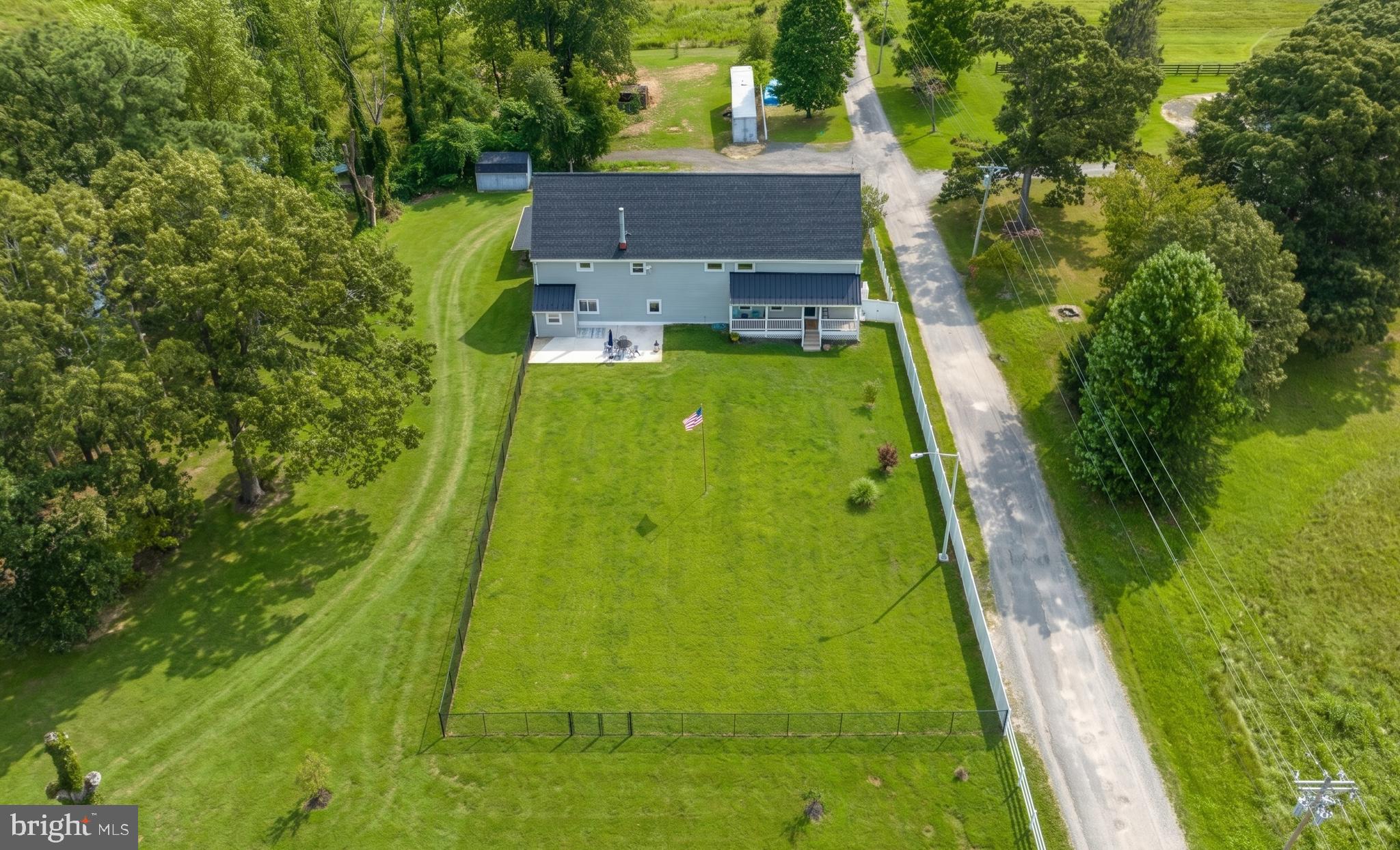Opportunities like this don’t come along often.
Set on 10 acres in Saint Leonard, this three-unit barndominium offers a rare chance to live, earn, and create something that fits your life. Whether you’re looking to house hack, bring multiple generations together with true separation, or run a business from home, this property gives you the flexibility to do it.
Inside, you’ll find 3,600 square feet of updated living space, thoughtfully divided into three private units. Each has its own entrance, kitchen, living area, and bath, making it easy to live in one while the others generate income, or give everyone their own space without sacrificing privacy.
Unit one offers two bedrooms and one bath. Units two and three each feature one bedroom and one bath. The interiors have been refreshed with new kitchens, bathrooms, flooring, paint, and a new roof, so you can move right in or start renting immediately.
Step outside and the setting takes over. Two ponds, open land, and wide views create a sense of space and calm that’s hard to find. The large patio and front porch invite you to slow down, while the oversized garage, workshop, and separate barn give you room to build, store, or grow a business.
Zoned mixed-use in the town center, this property opens the door to a variety of uses. Buyers should confirm specific plans with Calvert County, especially if considering additional building on the land.
Located just minutes from the heart of Saint Leonard, with an easy drive to Washington DC and Patuxent River Naval Air Station, you get the balance of privacy and convenience.
Live in it. Rent it. Share it. Build something bigger from it.
This is more than a property. It’s a setup for how you want to live next.