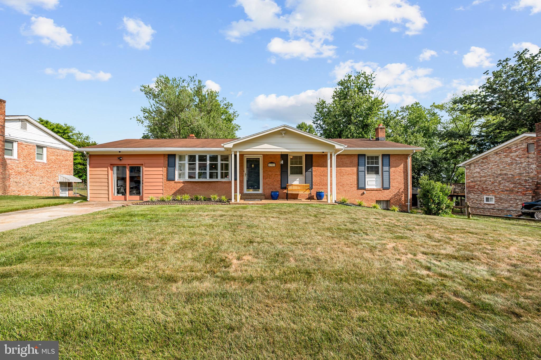 Welcome home to Brooke Jane Manor! This stunning all-brick ranch greets you with a manicured front yard and covered entry, setting the stage for the warm and inviting interior within. Gleaming hardwood floors flow throughout the sun-filled living room, anchored by an oversized picture window overlooking the lush front yard. Those same hardwood floors continue into the separate dining room, accented by a classic chandelier and French doors that open to the charming enclosed sunroom perfect for year-round relaxation. Updated with style and function in mind, the kitchen showcases maple cabinetry, dark granite countertops, a decorative tile backsplash with mosaic accents, recessed lighting, and a full suite of stainless steel appliances including a gas range, built-in microwave, dishwasher, and side-by-side refrigerator - all set on tile flooring. Retreat to the generously sized primary suite featuring hardwood floors, crown molding, and multiple windows that flood the space with natural light, complemented by an updated en-suite bath with a tiled walk-in shower and brushed nickel fixtures. A second bedroom with hardwood floors has been thoughtfully transformed into a stunning walk-in dressing room complete with custom built-in shelving and a dedicated vanity area. Featuring hardwood floors and a fresh neutral palette, the third bedroom offers a versatile space ready for your personal touch. Crown molding, a tiled tub/shower surround, granite countertop vanity, and dark wood cabinetry elevate the hall full bath. The expansive lower level is a generously sized carpeted family room with a brick fireplace and ceiling fan, alongside a professionally built multi-room recording studio with acoustic soundproofing panels, a dedicated control room with track lighting, and multiple flex spaces perfect for musicians, creatives, or an incredible rec area. Completing the lower level is a full bathroom, and a dedicated laundry room with a washer,  dryer and utility sink with exterior access. Step outside to the spectacular deck with a white pergola, ideal for outdoor entertaining while overlooking the large, fenced backyard. A spacious driveway provides ample off-street parking. Just minutes to Branch Avenue, National Harbor, Tanger Outlets, and Joint Base Andrews. Quick access to MD-5, Branch Avenue Metro, and I-495. Don't miss this incredible opportunity - schedule your private tour today!