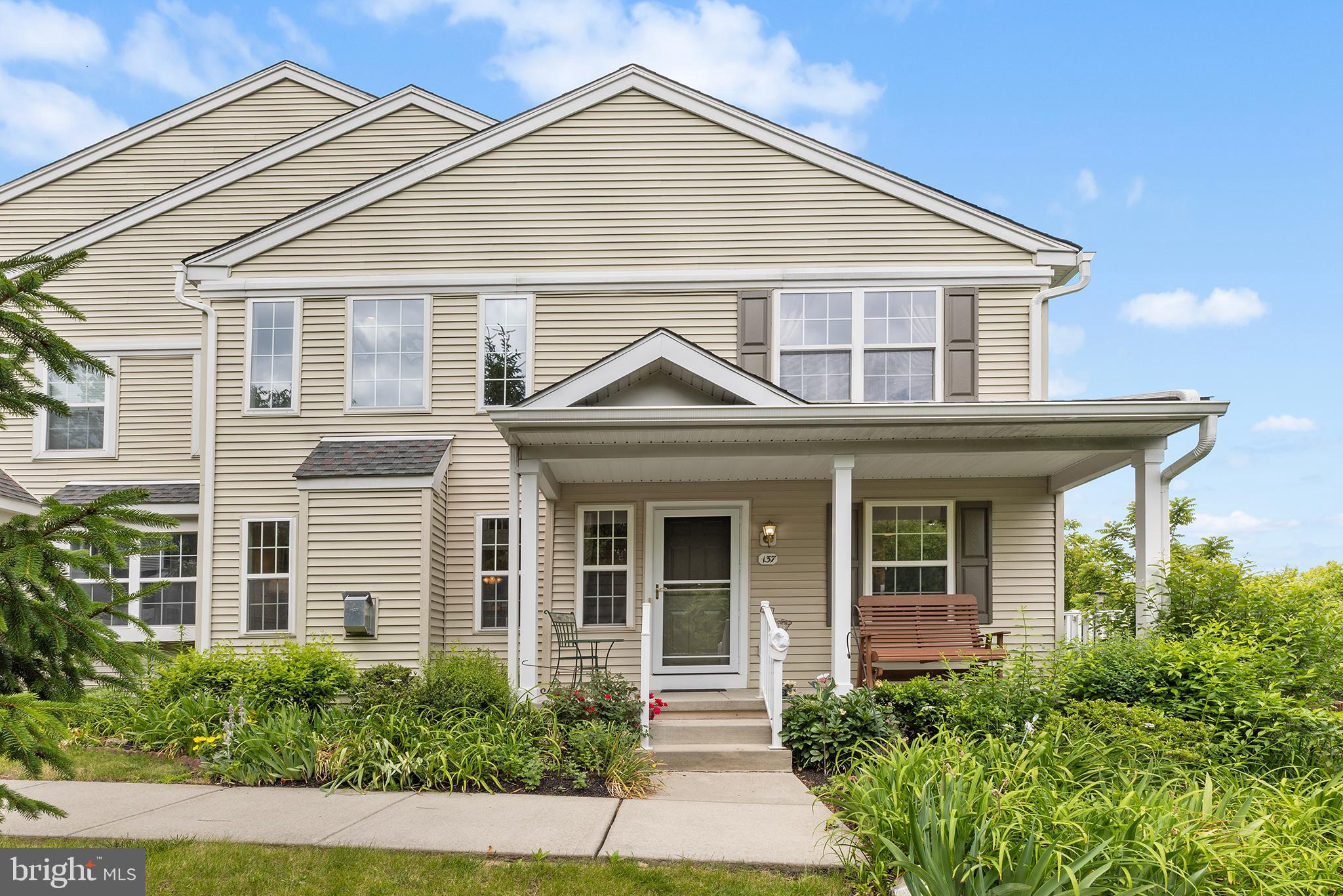 This is an ideal location in the community with beautiful nature open space views.  Welcome to 137 Granite Lane, first time offered for resale in the community this property offers two assigned parking spaces and several visitor spots nearby.   A perfectly sized front porch welcomes you into the home. Inside, the foyer features a convenient coat closet and opens to a dramatic two-story living room with a gas fireplace. A staircase leads to the second floor, where a loft-style family room overlooks this impressive area, creating an open and airy feel throughout.  From the living room there is a spacious area for dining.  The floor plan flows perfectly to a nicely sized kitchen with Corian countertops and lush landscape views from the kitchen sink and sliding door to rear stone patio.    The breakfast area is bright and sunny all day!    This home offers a first floor primary suite with two closets and a large primary bath with separate tub/shower and double vanity.   Upstairs, you'll find the spacious loft family room area with two walk in closets.  Additionally there are two nicely sized bedrooms that share a hall bathroom with tub/shower combo.   The lower level is unfinished with an egress window and offers plenty of room for storage or a future renovation to add more space.  This is a rare gem in the community ready to be polished by the next lucky buyer to call 137 Granite Lane home!     This is the best townhome setting in Chester County at this price point.  Don't miss out - Schedule your showing today.