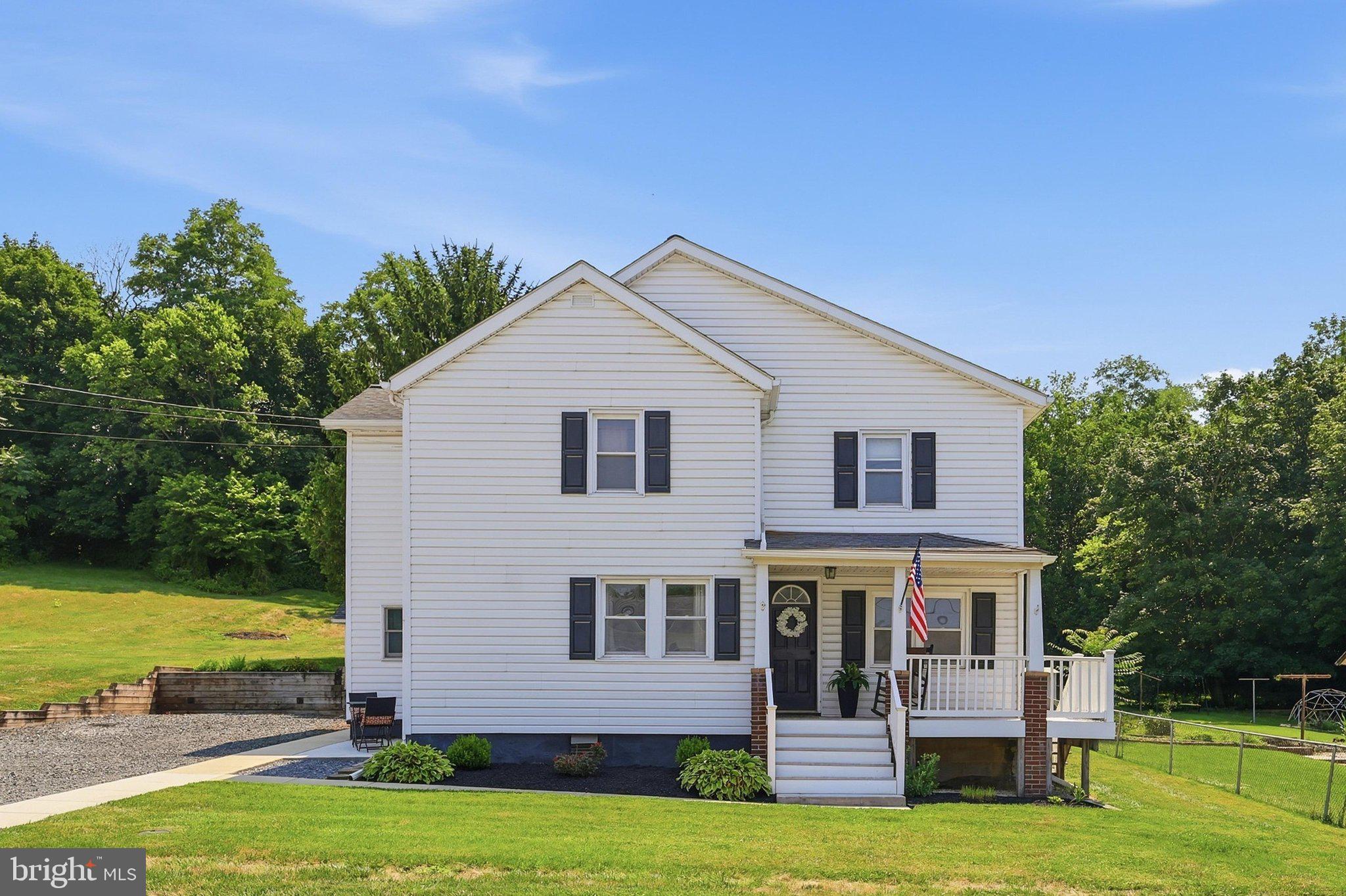 Situated on a spacious double lot totaling over half an acre, this charming 4 bedroom home offers more than 2,200 square feet of comfortable living space with room to spread out both inside and out.
Inside, you'll find generously sized rooms, hardwood floors throughout the home, a spacious country kitchen with table space, and an inviting family room featuring a cozy pellet stove. The flexible floor plan includes four bedrooms, 2.1 bathrooms, a welcoming sitting room, a versatile flex room ideal for a home office, playroom, or hobby space, and the convenience of an upstairs laundry room.
Outside, the expansive double lot provides plenty of room to garden, entertain, play, or simply relax and enjoy the outdoors. The backyard backs to mature trees, creating a peaceful setting with privacy that's rarely found on an in-town property. Enjoy your morning coffee on the covered front porch or host family and friends on the spacious rear patio overlooking the backyard.
Adding even more value, the property includes two detached garages located directly across from the house. The main garage features two oversized bays with workshop space, including one high-clearance bay offering added space for larger vehicles, trucks, or a vehicle lift. The smaller garage provides an additional garage bay with an attached storage shed. Whether you need space for vehicles, woodworking, hobbies, equipment, or extra storage, you'll appreciate the flexibility these buildings provide.
Conveniently located near parks, schools, and commuter routes, this property combines small-town charm with generous living space, an oversized lot, and exceptional garage and workshop space, making it a truly unique opportunity in the heart of Union Bridge.