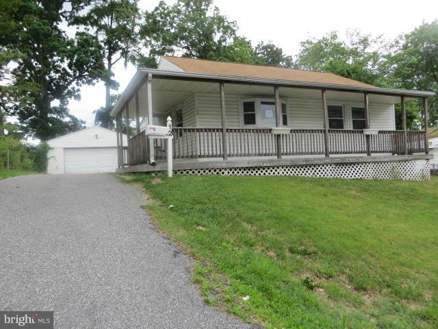 Cute Rancher in Victory Villa with wrap around porch and off street parking. Huge over sized 2 car garage with room for work bench & more ! Partially fenced private rear yard. Home has addition on back for extra bedroom or family room.  Pull down attic steps for extra storage. Open floor plan on main level . Nice size bedrooms and full bath. Close to schools and shopping . Easy access to 95 .