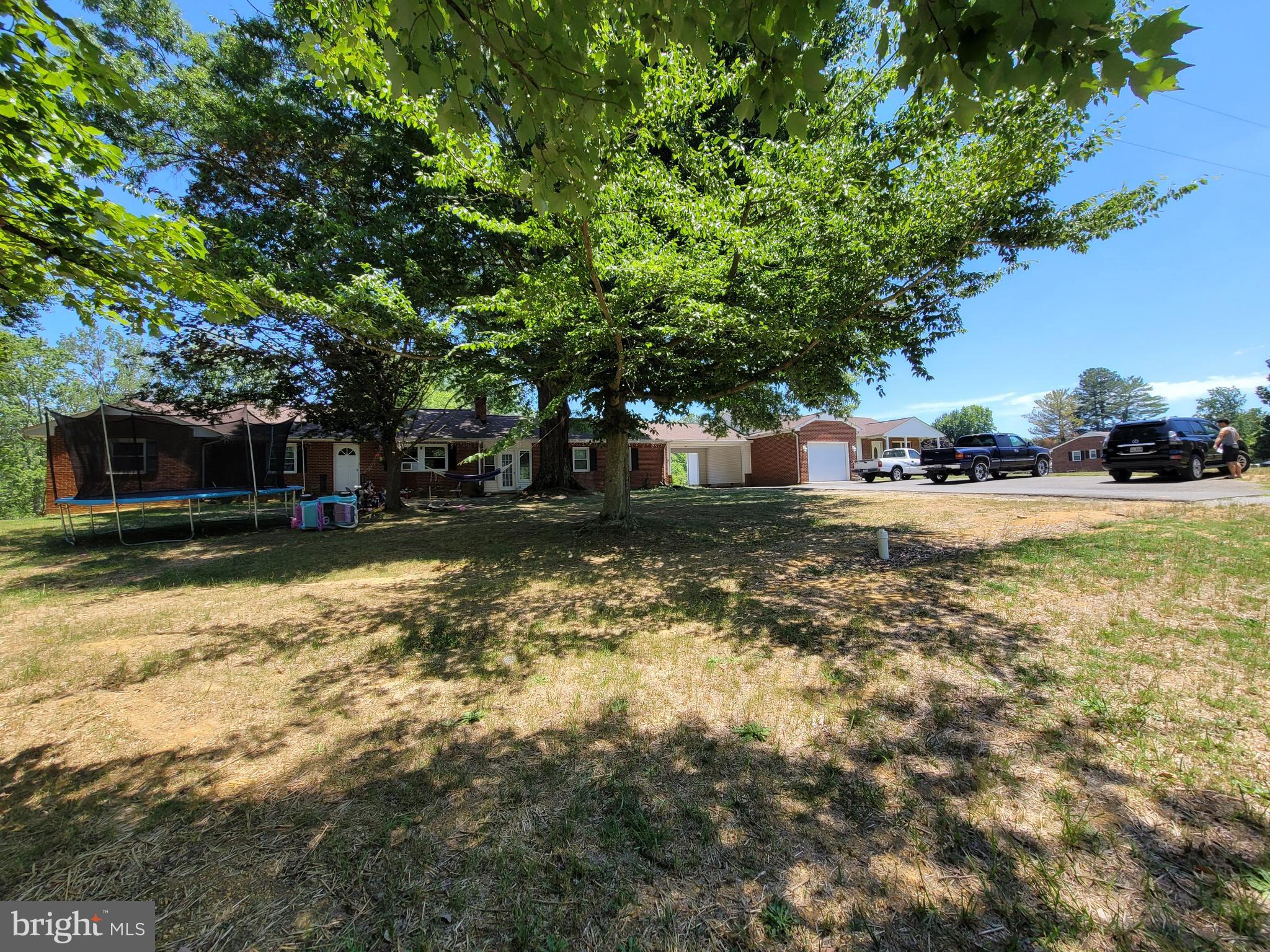 Sold As-Is. Pond on the property plus wood lot totaled approximately 22.58 Acres. Value is the land. Great opportunity for a developer. Two rental properties and a four-bay garage in the rear.