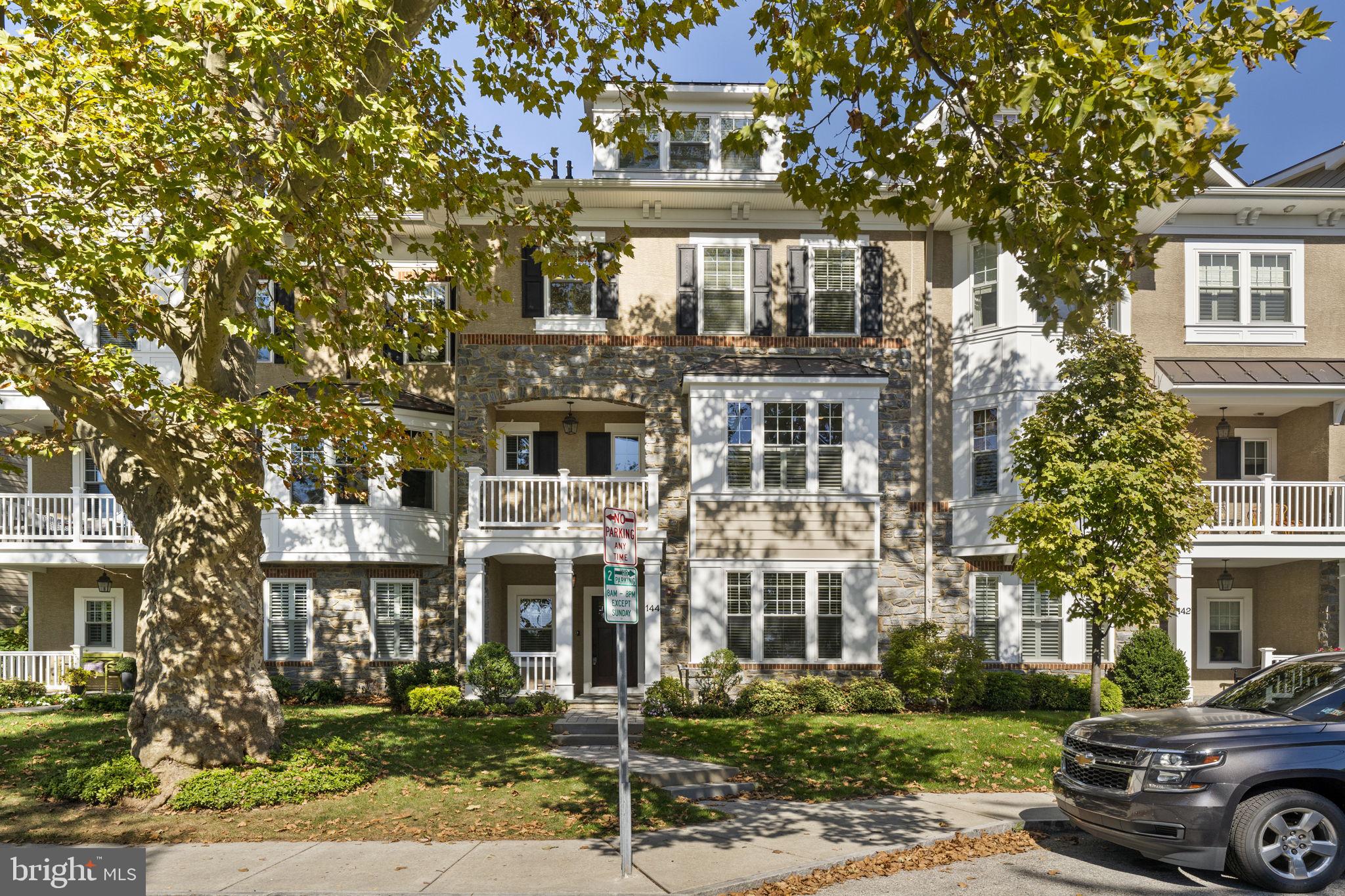 Welcome to 144 Pennsylvania Avenue, a beautifully designed townhouse combining elegance and functionality, just one block from Bryn Mawr's vibrant center. A cobblestone walkway leads to a covered front porch and into the garden-level foyer. The main level features an office/den/workout room, convenient two-car garage access, and beautiful hardwood floors that flow seamlessly throughout. An elevator conveniently services all four levels, ensuring ease of access throughout.

 The second level boasts a spacious, open-concept kitchen adorned with white cabinetry, crown moldings, granite countertops, and a large granite island. Equipped with Bosch stainless steel appliances, including a five-burner gas cooktop, wall oven, and built-in microwave, this kitchen is perfect for the avid chef. Additional highlights include an appliance storage area, a pantry, and a half bathroom. The kitchen opens to a generous living and dining area, complete with recessed lighting, a gas fireplace, and built-in shelving. Step outside to the charming patio and enjoy alfresco dining.

The third level offers a luxurious primary suite with a massive walk-in closet and a beautifully appointed en-suite bathroom featuring crown molding, double sinks, an oversized shower, a separate toilet room, and a Jacuzzi tub. This level also includes a second bedroom with a full bathroom and a large closet, along with a laundry room equipped with a utility sink and additional storage.

Continuing upward, the fourth level features a spacious bedroom and a full bathroom with a stall shower. Ample storage options include a walk-in closet, a second closet, and a finished oversized attic storage area.

Located within walking distance of Bryn Mawr Village, residents can enjoy easy access to a variety of amenities including, fine dining restaurants, boutique shops, grocery stores, the R-5 train, Bryn Mawr Hospital, Starbucks, a open air weekly farmers market, Bryn Mawr Film Institute, parks, and convenient access to public transportation. A perfect blend of suburban tranquility and urban convenience awaits.