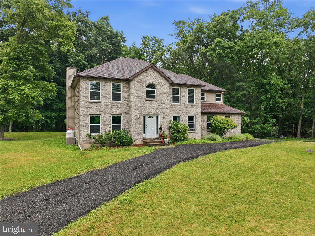 Welcome to 6144 Stony Brook Drive in East Stroudsburg! Situated on a beautifully landscaped oversized corner lot, this catty-corner Colonial offers the perfect combination of space, flexibility, and privacy. The backyard provides a peaceful retreat, ideal for entertaining, relaxing, or enjoying nature.

Inside, you'll find a highly desirable main-floor bedroom and full bath featuring a walk-in shower, along with a second kitchen that creates excellent potential for extended family living, guests, or multi-generational households. The main level also includes convenient first-floor laundry.

Upstairs, you'll discover four generously sized bedrooms, including a spacious primary suite, plus a massive bonus room that can serve as a family room, home office, playroom, gym, or media space.

The partially finished basement adds even more living space, while the abundant storage throughout the home ensures room for everything. With versatile living areas, a functional layout, and a private setting on a large corner lot, this home offers the space and flexibility today's buyers are looking for.