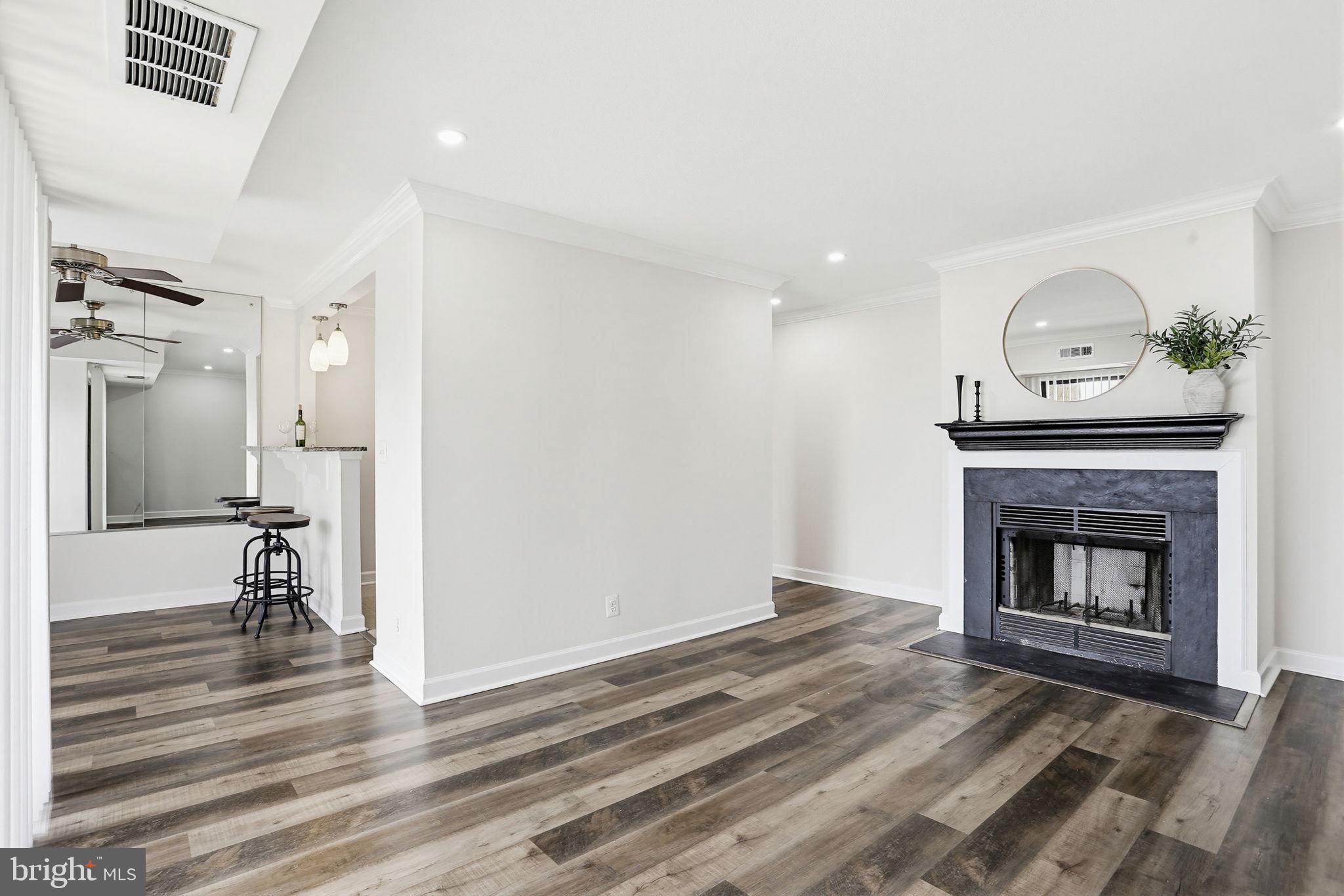 Stylish top-floor condo located in Columbia’s Village of Long Reach featuring brand new LED recessed lighting, crown molding throughout, updated plank flooring, and fresh paint. No carpet anywhere! The spacious layout includes two walk-in closets, brand new refrigerator and dishwasher, stainless steel appliances, gas cooking, sliding glass doors leading to a private balcony, and a cozy wood-burning fireplace. HVAC system replaced in 2024. Gated community access offers added privacy.

Monthly condo fee includes water and gas heating. Annual HOA fee includes Columbia Association/CPRA benefits helping maintain Columbia’s extensive walking paths, trails, parks, and community amenities. Columbia residents also enjoy access to multiple community pools available through Columbia Association membership, including nearby Jeffers Hill Pool. Conveniently located near shopping, restaurants, Blandair Park, commuter routes, Rt 29, Rt 175, and I-95. Walking distance to Jeffers Hill Elementary, Oakland Mills High School, the Jeffers Hill Neighborhood Center, and Jeffers Hill Pool.

Assigned parking spot is D18. There are visitor/guest spots just past the building.