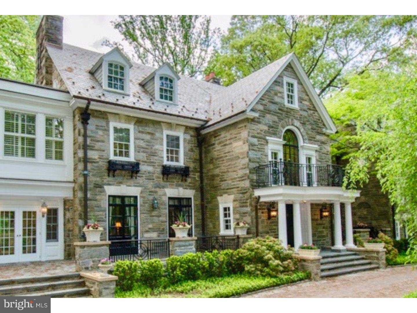 In the heart of Radnor Township sits an elegant, well maintained estate property. Private gated drive w/Belgian block accents, leads to this grand stone mansion w/slate roof and copper gutters.  Cobblestone & a brick apron accent the entrance w/stately columns. The oval brick garden has a gorgeous fountain and charming bronze statuary. Fabulous lush landscaping, with specimen plantings, surround the property. This magnificent home boasts a huge Reception Foyer, stately Formal Rooms,  5 fireplaces, outstanding original custom millwork and gorgeous quarter-sawn hardwood flooring.  The 6 bedrooms are ample sized and each has a private adjoining bath.  The private maid's quarters or au-paire suite has a private entrance.  The detached 5-car garage features a covered breezeway for direct access to the home.  The floored garage upper level, accessed from the turret, offers the potential for additional living space, complete w/electricity and plumbing.  Amid estate fencing, picturesque flagstone patios and walkways, sits a private in-ground pool. There are few estates of this level and quality left. It is in pristine condition, and has been lovingly maintained and updated for today's lifestyle, but with all the original features and millwork, it is truly reminiscent of a by-gone era with unparalleled craftsmanship that could not be duplicated today.