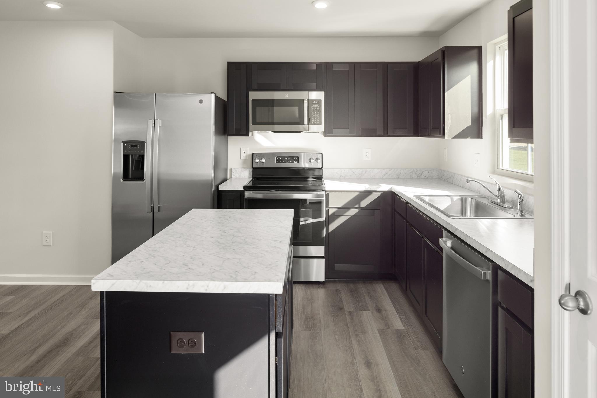This is the To‑be‑built Aspen with a basement plan at the Oak Leaf Meadows community! This thoughtfully designed home offers a spacious backyard, brand‑new kitchen appliances, and a new‑home warranty for peace of mind. Step into the welcoming great room and enjoy an open‑concept first floor that keeps everyone connected. The cozy kitchen includes the option for an island and a convenient powder room can be added. An entry from the 2‑car garage creates the perfect drop zone for coats and bags.
Upstairs, all three generously sized bedrooms feature ample closet space. A hall bath and second‑floor laundry provide everyday comfort and convenience. The primary suite is the true retreat, complete with a private bath and an oversized walk‑in closet. An unfinished basement  provides potential additional living or storage space.
Oak Leaf Meadows offers an ideal location in the Musselman School District—just 5 minutes to I‑81, 15 minutes to Martinsburg, and 20 minutes to Winchester. Closing assistance available with the use of the seller’s preferred lender. Lot premiums may apply. Other floorplans and homesites available. Photos are representative.
Visit the model home at 186 Inola Court, Inwood, WV 25428, and discover all The Aspen has to offer!