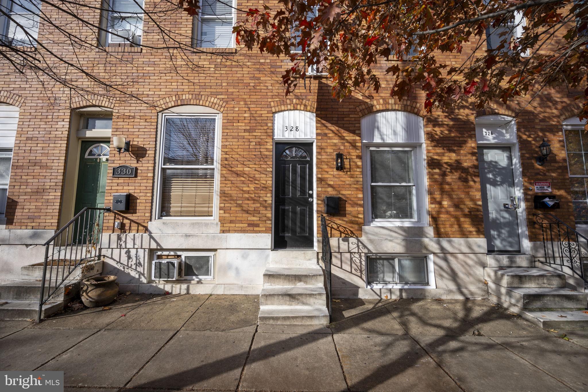 Welcome to 328 S Macon St, this beautifully renovated home offers 3 bedrooms, 3.5 bathrooms, and modern upgrades throughout. Step inside to an open-concept main level featuring brand new flooring, fresh paint, and a spacious living area that's perfect for relaxing or entertaining. The kitchen features granite countertops, stainless steel appliances, a large island, and plenty of cabinet space, making it the perfect place to cook and gather with family and friends. A convenient half bathroom is also located on the main floor. Upstairs, you'll find two spacious bedrooms, each with its own private full bathroom, offering comfort and privacy. The washer and dryer are also conveniently located on the upper level, making laundry day a breeze. The fully finished basement provides even more living space with a large family room, a third bedroom, and another full bathroom, making it perfect for guests, a home office, or additional living space. Outside, enjoy the fenced backyard with a private parking pad, a rare and highly sought-after feature in the area. Conveniently located just minutes from Patterson Park, Canton Square, Johns Hopkins Hospital, shopping, restaurants, and major commuter routes, this home truly has it all. Fully renovated and move in ready, don't miss your chance to make this your new home!