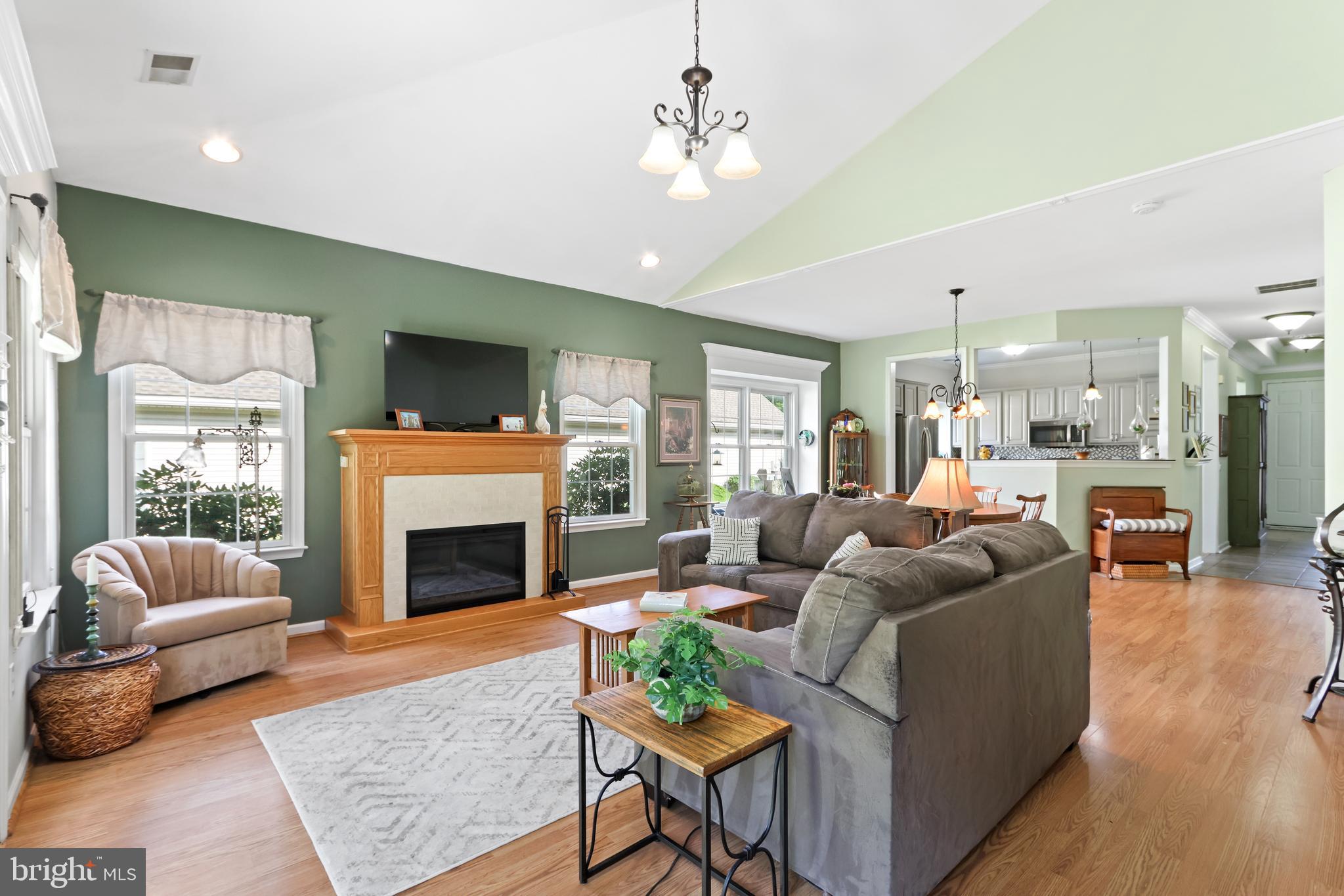 Located in the desirable 55+ community of Glenmoor, this beautifully updated 2-bedroom, 2-bath home offers comfortable one-floor living with a bright, open layout. A welcoming foyer with soaring ceilings and custom built-ins sets the tone as you enter. Just off the entry are the second bedroom and an updated full bath with a handicap-accessible walk-in shower, ideal for guests or a home office. Continue into the open main living area where the updated kitchen features granite countertops, tile backsplash, and updated stainless steel appliances, flowing seamlessly into the dining area and living room. Filled with natural light, the living room offers an electric fireplace and sliding glass doors leading to the private patio with a retractable awning. Privately situated at the rear of the home, the primary suite features a tray ceiling, a walk-in closet, and an updated en-suite bath with a handicap-accessible walk-in shower. Additional highlights include first-floor laundry, attic storage with stair access from the attached two-car garage, and numerous recent updates, including the HVAC system and hot water heater (within the last two years), roof (approximately 3–4 years old), a whole-home humidifier installed about a year ago, and gutters replaced just weeks ago. Enjoy low-maintenance living in a quiet, established community with a clubhouse and amenities, conveniently located near shopping, dining, and major roadways. Ask how to receive up to $5,000 lender credit towards closing costs or lowering your interest rate!