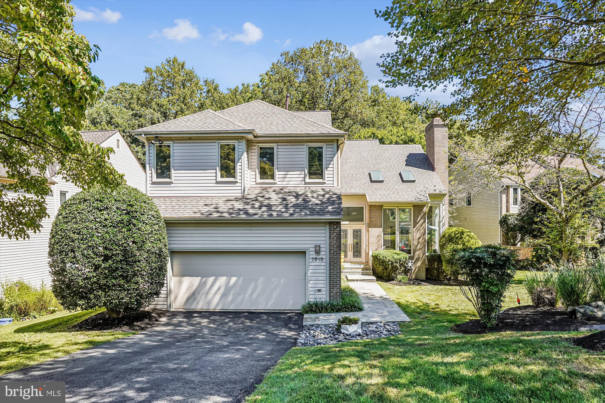 OPEN SUNDAY 11/9, 1-3PM!  An Exceptional Contemporary Masterpiece On Private Cul-de-Sac! 
Perfectly situated at the end of a quiet cul-de-sac, backing to a tranquil wooded creek, this stunning 5-bedroom, 4.5-bathroom Contemporary Colonial offers an unparalleled blend of nature, luxury, and location. With thoughtful renovations throughout, including a brand-new roof & new skylights(2024), fully renovated gourmet kitchen (2019​) , stylishly remodeled powder room (2018), and primary bath(2009​), upgraded Thompson Creek windows (including new updates in 2025), and a new attic fan (2024), this home is truly move-in ready. And best of all—there's no HOA!

A charming flagstone walkway leads into a striking, modern foyer where soaring ceilings and skylights welcome you into the sun-drenched, showstopper living room. Floor-to-ceiling windows flood the space with natural light and showcase wooded views, while a commanding stone fireplace anchors the room with style and warmth. Just off the foyer is a renovated powder room with a sleek vanity and oversized mirror, while a hallway leads to the oversized two-car garage and a sunlit laundry room with a storage closet, and built-in shelving.

The formal dining room, enhanced by large replacement windows overlooking lush greenery, sets the stage for elegant gatherings. The ​f​ully renovated modern gourmet kitchen is a chef’s dream, boasting a picturesque breakfast nook surrounded by an oversized scenic window, top-of-the-line stainless steel appliances, and a sleek quartz center island with a cooktop and breakfast bar. Craftmade cabinetry, a deep sink, and abundant storage (including pantry closet, pull-out drawers, spice racks, and an appliance garage) ensure effortless organization.  Open to the kitchen, the family room offers a cozy atmosphere with access to the private deck—an ideal space for relaxing or al fresco entertaining surrounded by a peaceful wooded setting. 

Upstairs, a dramatic open hallway overlooking the striking living room and foyer below adds an architectural wow-factor—creating a light-filled, gallery-like feel that is both airy and grand.   The spacious primary suite features vaulted ceilings, and multiple windows. A custom dressing area leads to the bedroom and includes several walk-in closets, built-in drawers, custom shelving, and wall closets for an abundance of storage. The renovated primary bath is a true standout, with a vaulted ceiling, heated floors, and wide windows overlooking the backyard. A heated ceramic tile floor, Jacuzzi tub, dual vanities with vessel sinks, a walk-in shower, and private water closet bring spa-like comfort to everyday living.

Three additional bedrooms and two full baths are situated at the other end, offering flexible living for guests or family members while maintaining the seclusion of the primary suite. Each bedroom offers double-door closets, ceiling fans, and large windows. The updated bathrooms include features such as a double vanity, new toilet (2024), and a brand-new window (2025).

The finished walk-out lower level features a large recreation room with built-in bookshelves, a wet bar, a beverage fridge, and a pool table, which conveys with the home. Additional features include a spacious fifth bedroom with large window views, a dedicated exercise room, a full bath, a large storage/utility room, and ​a​ door leading directly to the backyard for convenient access.

Whether you're hosting friends, hiking scenic trails at nearby Cabin John Regional Park, or commuting easily into the city, this home offers the best of all worlds. Enjoy access to miles of trails, ball fields, playgrounds, and recreational amenities just minutes away. A multitude of premium shopping and dining options just minutes away make errands and evenings out a breeze, while close proximity to I-270 and the Capital Beltway ensures easy access to Bethesda, Rockville, and Washington, D.C.
Don’t miss out!