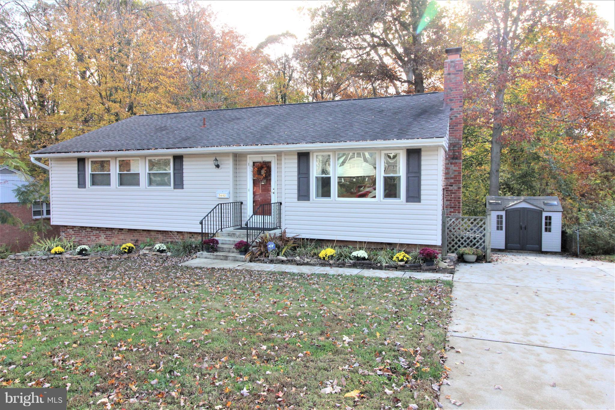 Updated spacious rambler in prime location!  Hardwood floors on main level.  Living room with gas fireplace with a decorator's dream mantel.  Updated baths.  Wonderful lot backing to trees and parkland, with huge, multi-level decks to enjoy the view!  Updated baths with tile floors. Neutral decor.   Fantastic property, with easy access to shopping, transportation, & great schools!