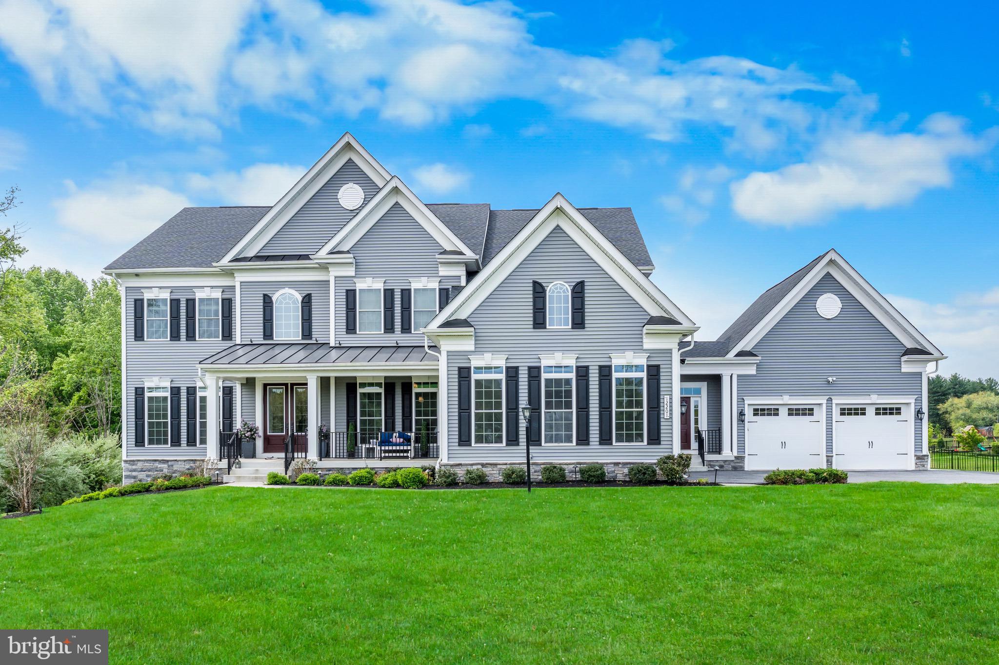 Live in the lap of luxury where style meets function in this exquisite, custom-built home. Nestled on over an acre in Marriottsville's prestigious Walker Meadows, this well-appointed home boasts over 8,000sqft. of living space, an oversized 4-car garage, a resort-style backyard, high-end entertaining spaces throughout, with well-thought-out features galore! Inside, the home is equipped for comfort, functionality, and everyday convenience starting with two outside entrances; one leading into your grand foyer, while the other leads into a practical mud-room off of your main-level laundry room. Natural light flows through the impressive atrium window as you enter your great room with 20' coffered ceiling, a gas fireplace with elegant mantle, and built-in shelving. The gourmet kitchen is a chef's dream equipped with 2 giant islands, abundant cabinet space, double wall ovens, french door refrigerator, a gas cooktop with kettle faucet, stainless steel farmhouse sink, a mini drink fridge, a bar area with additional mini fridge, a walk-in pantry, pendant lighting, and a breakfast nook that leads out onto an expansive, low-maintenance composite deck. The main level also includes his and hers offices, an elegant formal dining room with tray ceiling, and an additional bar area/butler's pantry, as well as a sizable powder room. Upstairs you will find a gorgeous primary suite with an oversized walk-in closet, a tranquil sitting area, and a private balcony with breathtaking views of your outdoor oasis, perfect for enjoying that morning cup of coffee or evening cocktail. The palatial-style ensuite bathroom is designed to melt away stress, equipped with a soaking tub, double shower with frameless glass door, double vanity, and a separate water closet. This upper level, overlooking the great room from the catwalk, also hosts 3 additional bedrooms, each with their own full, private bathrooms, as well as your bedroom-level second laundry room! The basement is an entertainer's dream with plenty of space for seating, gaming tables, a separate media room, as well as a fifth bedroom and additional full bathroom, perfect for guests! This level also has a large, unfinished storage area, and is equipped with your whole-home water conditioning system with an additional 400-gallon water storage tank. Step outside to a lavish backyard oasis built for relaxing and entertaining. The show-stopping gunite in-ground pool features a PebbleTec finish, a self-cleaning system, three pumps and two filters, an automatic pool cover, plus color-changing fountains, and a cascading waterfall for a true resort-style feel, complete with a propane heater for extended swim season enjoyment. A tanning ledge with bubblers invites laid-back afternoons in the sun, while the connected spillover spa is perfect for unwinding year-round. Enjoy your favorite playlists with a Sonos music system and speakers positioned around the pool, a natural travertine pool deck, a cozy outdoor fireplace, and a gazebo for evenings with friends and family. The yard is fully fenced and borders protected conservation land on two sides, offering exceptional privacy and a peaceful, natural backdrop. Additional features include dual zone heating and cooling with a separate room damper system upstairs for customized temparature settings in different rooms, Sonos speaker system in the kitchen and primary suite, gleaming hardwood floors, recessed lighting and upgraded finishes throughout, and more storage than you'll know what to do with! Located within minutes of major commuter routes, close to shopping, dining, and entertainment, and zoned for Howard County Schools! Don't miss your chance to experience this stunning property in person! Book your private tour today!