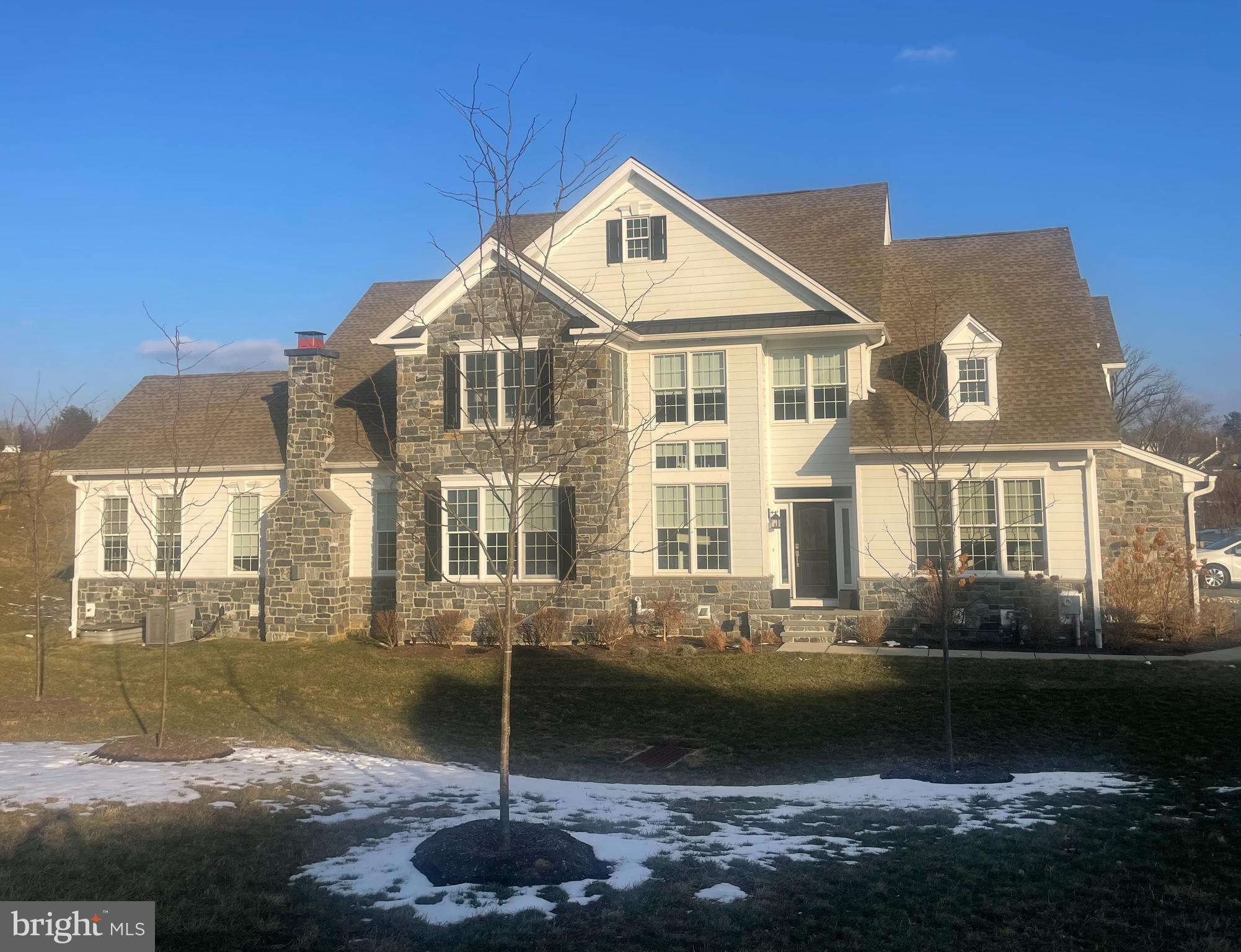PROFESSIONAL PHOTOS FORTHCOMING. Welcome to an easy turn-key lifestyle at 3813 Meadow View Farm Rd., a stunning BRYN ATHYN end unit carriage home in the sought-after Liseter community. Built in 2021 with many upgrades (over $200,000) and sleek finishes, this carriage house with a FIRST FLOOR Primary suite features 3 bedrooms, 2 full bathrooms and a half bath. Enter into the airy 2-story foyer with a sweeping, curved staircase, automatic shades and hardwood flooring throughout. To your right is a study with a cathedral ceiling, glass French doors and a ceiling fan. To your left is an expanded dining room with a beautiful chandelier, perfect for casual gatherings.  Adjacent is the kitchen with white shaker-style cabinets, granite countertops, upgraded stainless steel Jenn Air appliances and an island with glass pendant lights. Open to the kitchen is the expanded Family room with gas fireplace, and a soaring cathedral ceiling. Just beyond the great room is a bonus sunroom with walls of windows, perfect for reading & relaxing or a second office. Next to the the sunroom is the Trex deck, a nice spot to entertain on a summer evening. The expanded FIRST FLOOR primary bedroom boasts a tray ceiling, ceiling fan and a walk-in closet. The primary bath includes an oversized shower with bench, frameless shower enclosure, double vanity, linen closet and separate WC. A powder room, first floor laundry room with extra cabinetry and cubbies and an expanded  2 car garage make this home perfect for one floor living! The second level features a huge loft, 2 bedrooms and a jack and jill bathroom. At the top of the steps is a spacious loft which can be a teen hang-out, music/game room or second living room. This loft could be converted into a 4th bedroom, if needed.. There are 2 bedrooms with large closets and a jack and jill style bathroom with 2 vanities, and a tub/shower combo. You will find ample storage in the hall, where there is a walk-in storage closet, great for storing items or luggage. The lower level is unfinished and dug out to 10 feet, allowing high ceilings if you choose to finish it. The Liseter community boasts country club amenities: a gym within the clubhouse, tennis & pickle ball courts, bocci ball, infinity edge pool, open air pavilion, walking trails, and an 6000 sq. ft. award winning barn for social gatherings. The HOA takes care of your grass cutting, mulching and snow removal. Conveniently located next to the prestigious Episcopal Academy and close to the towns of Wayne and Newtown Square with Whole Foods and The Shoppes at Ellis. Great Marple Newtown Schools! This is the one!