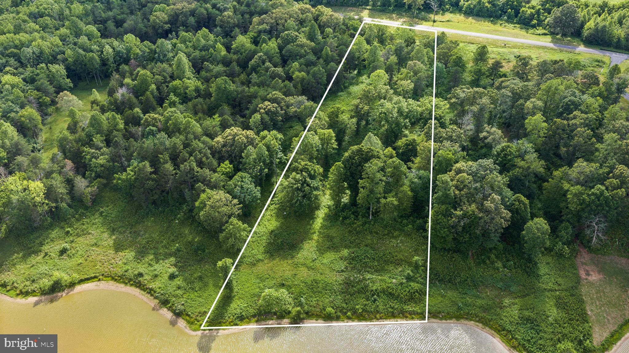Excellent waterfront investment opportunity at Lake Anna!   Over 3 acres of stunning waterfront property with over 102 feet of beautiful shoreline.   Construct your very own private boathouse up to 2,000 square feet in size!   Located on Lake Anna's public side, where buyer demand is high and continues to push the limits.  Individual buyers: exceptional opportunity to build a private waterfront retreat, away from it all in beautiful and historic Orange County (home of James Madison, fourth President of the United States!).   Short term rentals are permitted here and generate substantial rental income at Lake Anna.  Ideal location: boat (or drive) to nearby popular waterfront restaurants, The Cove, Tim’s, The Lake Anna Taphouse, Coffee & Creamery, and more!