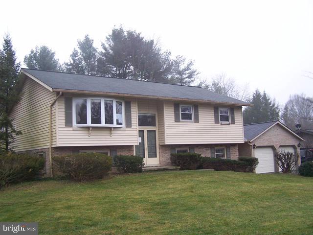 Large bi-level in quiet mature neighborhood in Manheim Township featuring 3 Bedrooms & 2.5 baths and walking distance to school. Includes large combo Living Room and Dining Room leading to Sunroom w/ vaulted ceiling & large open Kitchen. Master Bedroom w/ full bath, large lower level family room W/ built in cabinets and half bath extra large utility room & breezeway leading to large 2 car garage. Semi private backyard & much more. Great potential