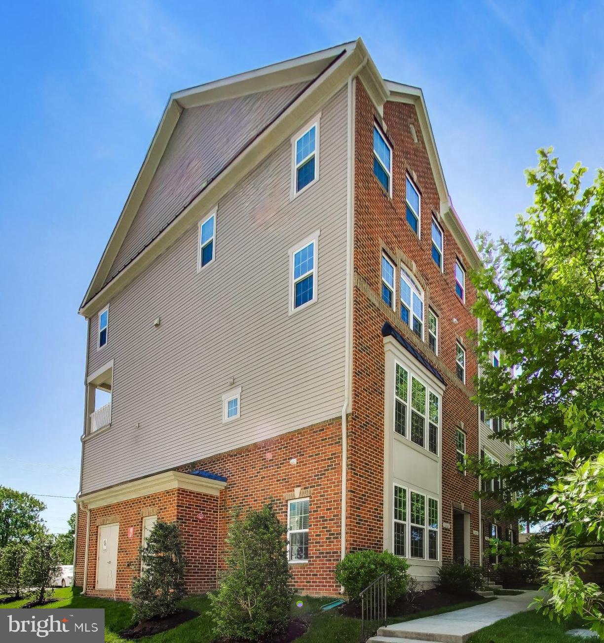 Beautiful two-level, end-unit home offering a bright, open-concept floor plan and a comfortable layout designed for everyday living. The spacious living room features hardwood flooring and provides plenty of room for both a sitting area and a dining area, creating an inviting space for relaxing, entertaining, or hosting guests.

The kitchen is beautifully appointed with granite countertops, stainless steel appliances, a breakfast bar, plenty of cabinet space, a pantry, and a functional layout that opens nicely to the main living area. The open flow between the living, dining, and kitchen spaces gives the home a warm and welcoming feel from the moment you step inside.

Upstairs, the primary bedroom offers a comfortable retreat with neutral carpet, a ceiling fan, dual walk-in closets, space for a sitting area, and a private full bathroom. Down the hall are two additional bedrooms, each featuring neutral carpet and ample closet space, along with a convenient hallway bathroom. The upper-level laundry room adds everyday practicality and makes the bedroom level even more functional.

The exterior includes a private balcony, private driveway, and a one-car garage, adding valuable outdoor space, parking, and storage. Conveniently located near the Odenton MARC commuter train, Route 32, Route 175, Fort Meade, NSA, shopping, restaurants, and everyday amenities, this home offers a wonderful combination of comfort, convenience, and location.