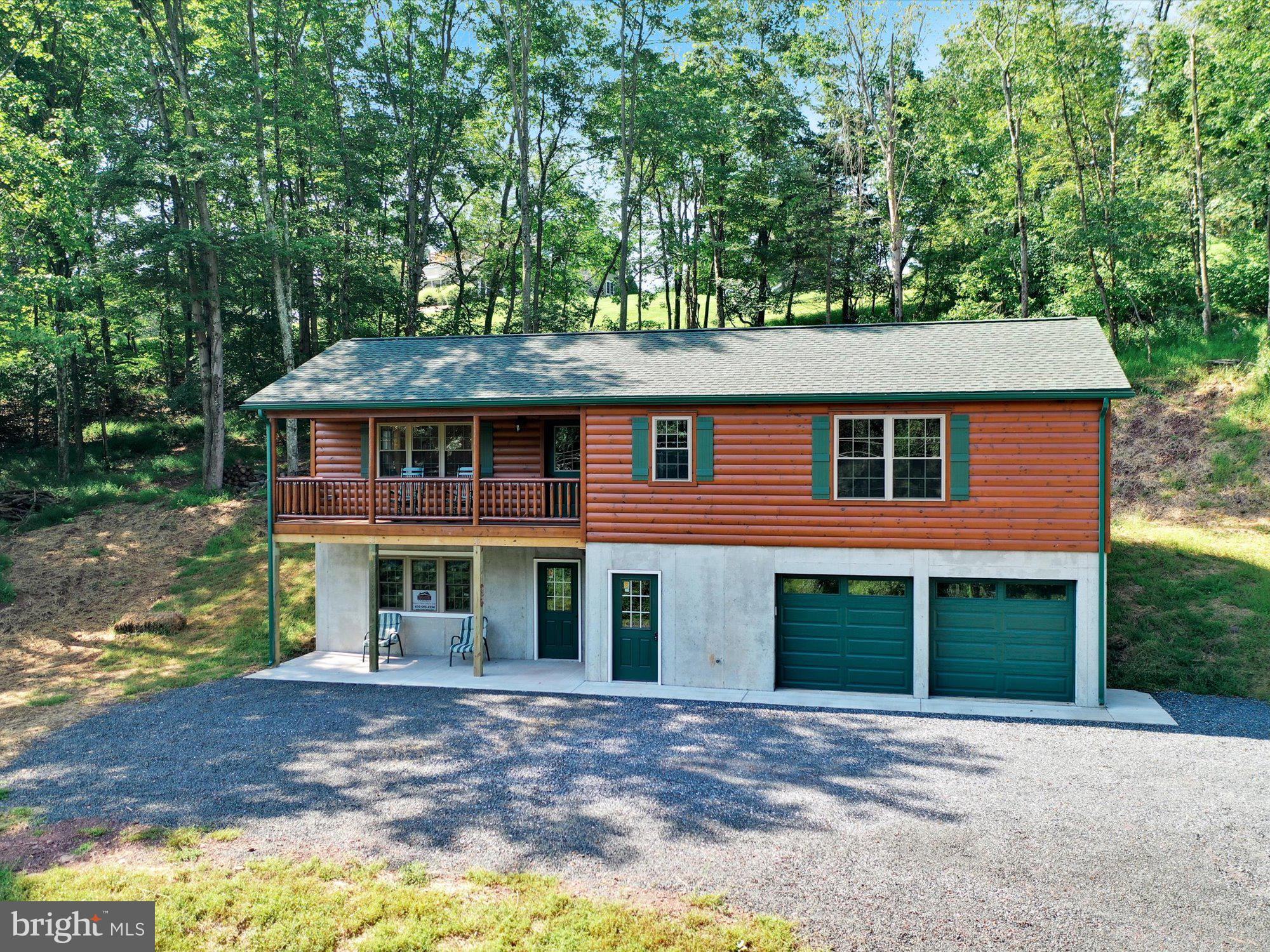 The builder of this brand new, move-in ready and absolutely STUNNING **2BR/2BA** private cabin on 0.9 acre in the Gold Star Community of Lake Wynonah is Cozy Cabins LLC. House has never been occupied by the current owners and is awaiting new buyer's enjoyment! The home is a 24 x 52 Frontier model, constructed using 2x6 stud walls and 2x10 floor joists. The roof is constructed using engineered trusses spaced 24 inch on center. The roof is decked with 5/8 inch OSB sheeting and covered with synthetic roof underlayment with ice and water shield underlayment at the eaves. Green GAF LIFETIME architectural shingles complete the roofing package for a worry free system. Matching green seamless gutters and downspouts installed to preserve and protect the roof and the foundation from potential rain water issues.  The 2x6 walls are insulated to a factor of R 21. The ceiling is insulated to a factor of R 38. The entire house is wrapped in Tyvek house wrap.  No drafts and a super insulated house. Comfortable and efficient. Current owners are installing R 30 pink insulation in the basement ceiling and garage ceiling. R 30 is approx 9.5 inches thick.  5/8 inch thick Firexx Fire Code drywall in the garage. Fire rated steel door between the garage and the basement. There is a radon pipe system embedded in the concrete floor of the basement. Basement is poured concrete, rebar reinforced with 9 ft walls. The basement/garage is supported along the entire 52 foot length by a substantial, steel I-Beam and steel posts embedded in the underground concrete footers.  With 3 outside 36x80 entry doors and 3 large double hung windows (and two small end ventilation windows) combined with the 2 Coplay R18 matching green garage doors (with Lift Master Wi Fi enabled garage door openers), the basement can become just about anything imaginable... you name it! The basement walls have been coated with Drylok brand waterproofing and even the garage floors have been treated and sealed with a concrete sealant to prevent stains etc. Center drain in garage. The circuit breaker box is a 200 amp unit with tons of space for future expansion if needed. Brand new electric pole installed on Buck Drive by PP&L. There is also conduit laid in to accommodate cable TV and landline phone and Wi Fi.  All the appliances are NEW Whirlpool. The microwave has a built-in exhaust fan, vented to the outdoors/not recirculating.  Windows are ProVia insulated double hung low e argon top of the line. Doors are Pro Via 9 lite fiberglass.  Plumbing is all Moen. Ceiling fan in every room.  Flooring is engineered yellow pine T&G with a durable clear coat. The flooring is mounted on a glued and screwed subfloor to prevent squeaks and any vapor penetration from the basement.  Walls and ceilings are 3/4 inch T&G knotty pine and double clear coated.  Wired smoke detectors are in all rooms.  Outside lights and GFCI receptacle front and rear.  Soft close cabinets and drawers in the kitchen. Stainless steel double sink. Designer countertops with beveled edges. Gorgeous, solid wood doors and wood shelving in all closets. One piece shower stalls...no seams, no caulk to maintain. Septic system is designed for a 4 bedroom home. It is a 1500 gallon dual tank in ground standard septic (no sand mound or holding tank)! The swale pipe under the driveway is a 24 inch x 40 foot long corrugated plastic pipe as required by an engineering study done by Dsim Design. It is topped with crushed stone and other substrates to protect it from damage.  PRACTICAL LOCATION: this home is within easy walking distance to boat docks/canoe/kayak/paddleboard launch and picnic area at G Dock, B Dock, Grove/Lodge and Community Pool! Lake Wynonah is a gated, Gold Star lakes community, featuring 2 gorgeous, pristine freshwater lakes (Lake Wynonah is approximately 90 ft. deep/2.5 miles long and Fawn Lake 45 ft./3/4 mile long). This like-new home in a pristine and private setting won't last long. Make this cozy cabin YOURS!