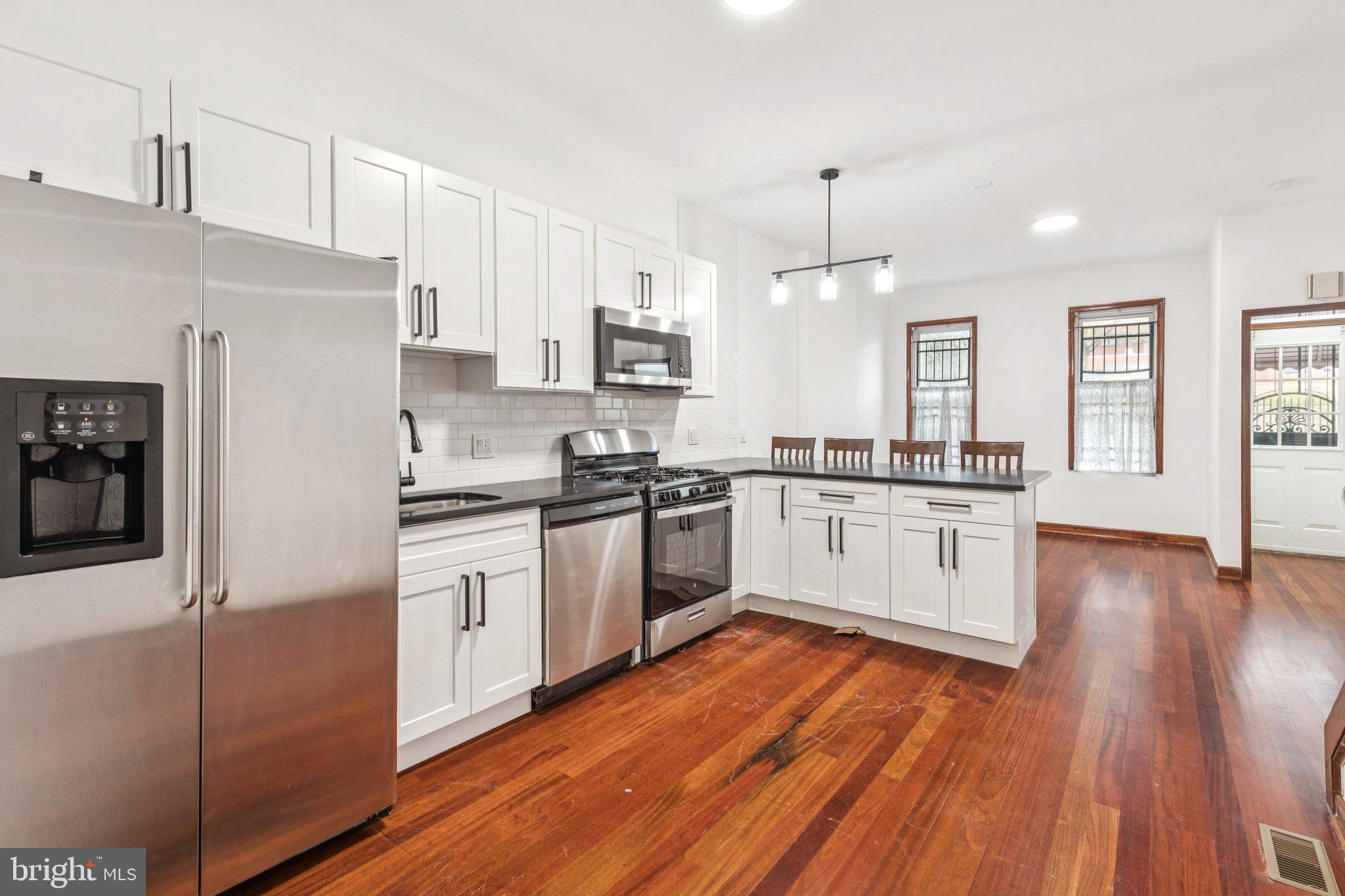 This renovated 4-bedroom, 2-bathroom row home in East/West Kensington features central heat and air, a chef’s kitchen with modern appliances, and two stylish, tiled bathrooms. The open living and dining area has hardwood flooring, lots of natural light and the convenience of a first floor bedroom and full bath. Each bedroom offers ample room for living or office space and the full, clean basement provides additional storage. Enjoy the convenience of a vibrant neighborhood with cafes, restaurants, and shops just steps away. Easy access to public transportation and major roads makes commuting to Center City, University City, and the stadium district simple. All offers presented