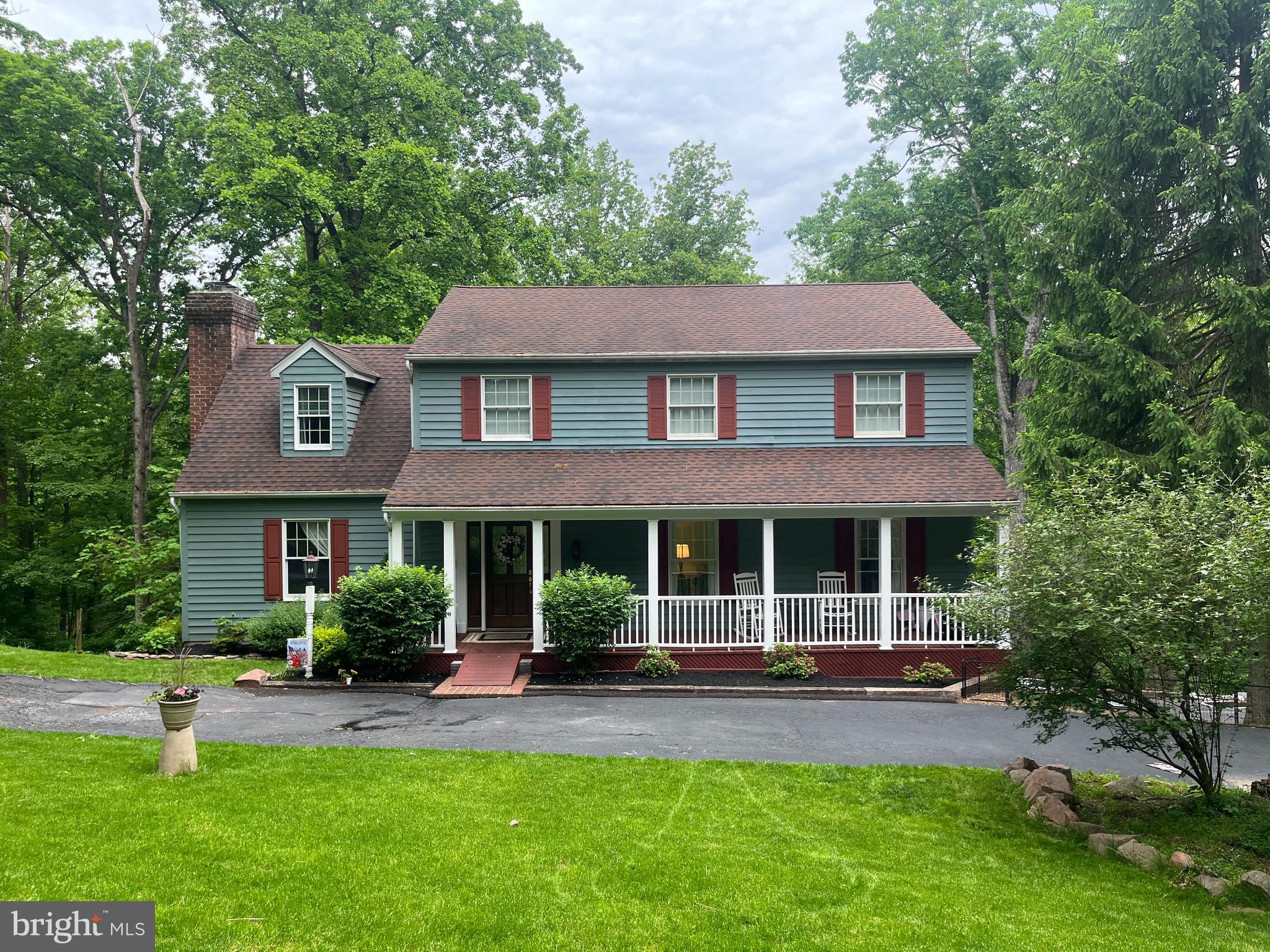 Nestled on 3.7 beautifully wooded acres, this meticulously maintained Colonial offers the perfect blend of privacy, comfort, and convenience. Surrounded by nature, this property provides endless opportunities for outdoor enjoyment—whether you're watching wildlife from your deck, exploring the woods, or building the treehouse you've always dreamed of.

A welcoming circular driveway leads to the front entrance, while a separate driveway provides easy access to the attached garage. Step inside to a spacious foyer that opens to an inviting floor plan designed for both everyday living and entertaining.

The heart of the home is the eat-in kitchen, featuring a center island, dual pantries, abundant cabinet space, and access to the rear deck overlooking the peaceful backyard and mature trees. A formal dining room offers the perfect setting for holiday gatherings and special occasions.

This home offers 4 generously sized bedrooms, 2 full baths, and 1 half bath, providing plenty of room for family and guests. The lower level includes a walk-out studio area, ideal for a home office, hobby room, fitness space, or creative retreat. An attached 2-car garage completes the package.

Conveniently located between York and Harrisburg, you'll enjoy the tranquility of country living while remaining just minutes from shopping, dining, schools, and major commuter routes.

If you've been searching for a well-cared-for home with acreage, privacy, and room to explore, this exceptional property is one you won't want to miss.