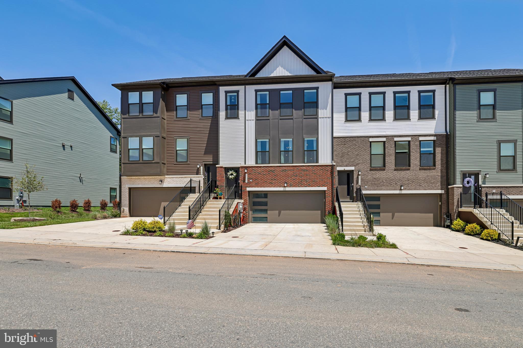 Move right into this beautifully maintained, nearly new townhome offering 4 bedrooms, 3 full bathrooms, and 1 half bathroom with a spacious, thoughtfully designed layout. Less than one year old, this home features custom paint throughout, a gourmet kitchen with upgraded cabinetry and countertops, a large center island with pendant lighting, a pantry, and recessed lighting. The open living spaces are complemented by an electric fireplace, while the bedroom-level laundry adds everyday convenience.

The versatile lower level includes an additional living area, a private bedroom, and a full bathroom, offering flexible space for guests, a home office, or other needs. The attached garage has been enhanced with custom flooring and paint, creating a polished, functional space.

Enjoy outdoor community amenities including trails, an outdoor pool, clubhouse, fitness center, dog park, picnic areas, recreation center, and playgrounds. Conveniently located with easy access to major commuter routes, including MD-295/Baltimore-Washington Parkway, and in close proximity to Fort Meade. Retail and additional conveniences are planned for the surrounding community. Schedule your private tour today!