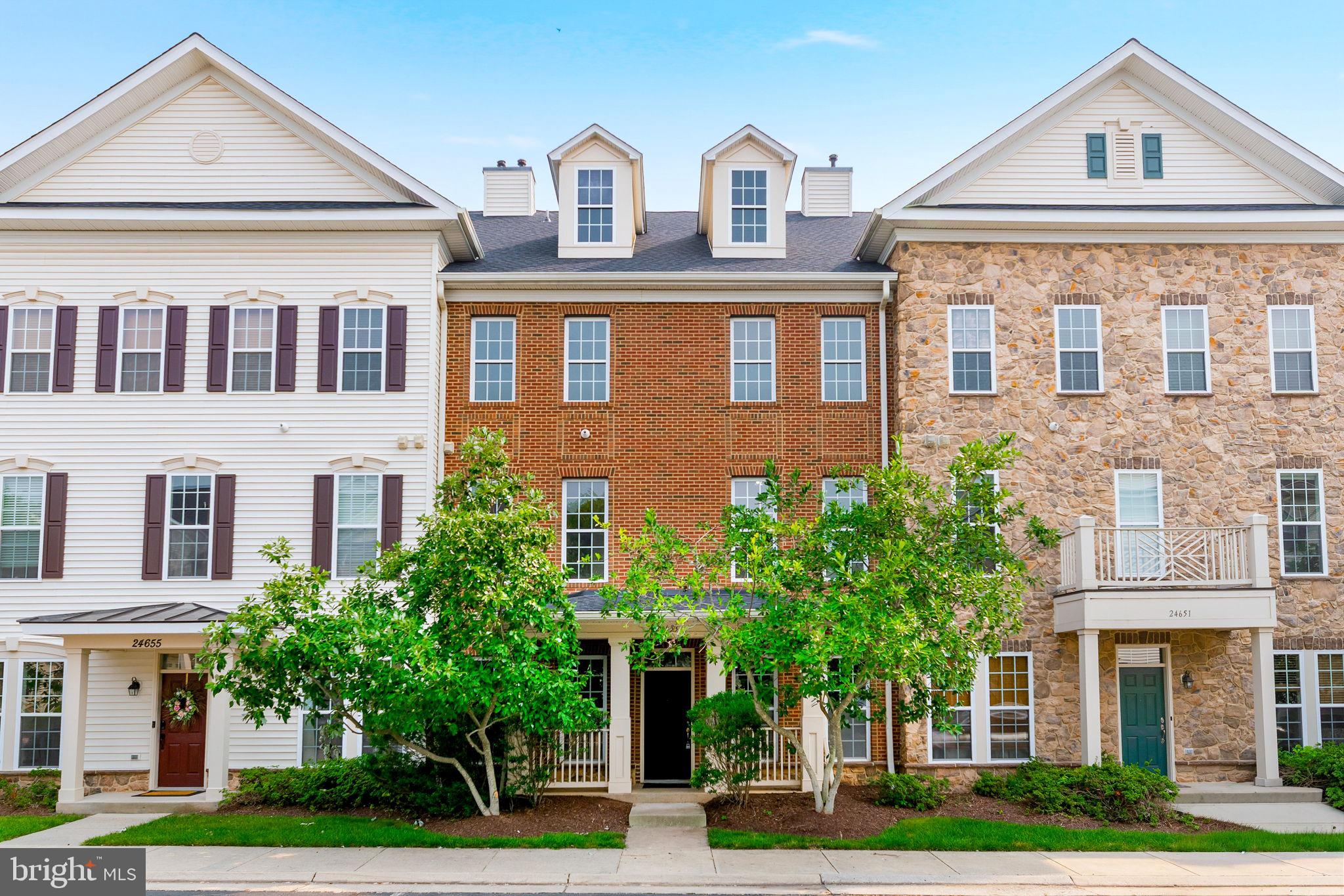Welcome to this beautifully updated, like-new condominium located in the highly desirable Stone Ridge community, where luxury, convenience, and exceptional amenities come together. Thoughtfully refreshed from top to bottom, this move-in-ready home features fresh paint throughout, all-new carpet, newly installed designer light fixtures, updated door hardware, and custom touches that create a modern, elegant feel from the moment you step inside.

The main level offers an open and inviting floor plan designed for both everyday living and entertaining. The spacious family room features a cozy gas fireplace and flows seamlessly into the dining room, highlighted by custom trim details that add warmth and character. The gourmet kitchen is the centerpiece of the home, offering granite countertops, an abundance of cabinet space, and plenty of room for meal preparation and gathering with family and friends. The main level also includes a convenient full laundry room, an updated powder room, and direct access to your private one-car garage.

The entire second level is dedicated to an impressive primary suite that truly feels like a private retreat. This oversized sanctuary features a spacious sitting area perfect for reading, relaxing, or creating a second office space, along with two large walk-in closets, including one with custom built-in organizers. The luxurious primary bathroom is designed with comfort in mind and includes dual vanities, a soaking tub, separate walk-in shower, and a private water closet.

The upper level continues to impress with a versatile loft overlooking the home, ideal for a home office, study area, playroom, or additional lounge space. Two additional generously sized bedrooms share a large full bathroom, offering ample space for family members or guests. Every room throughout the home is exceptionally spacious, providing a comfortable and functional layout rarely found in similar properties.

Living in Stone Ridge means enjoying one of Loudoun County's premier amenity-rich communities. Residents have access to a clubhouse, resort-style swimming pool, fitness center, basketball and tennis courts, dog park, playgrounds, jogging and walking trails, and beautifully maintained common areas. Best of all, this home is located directly across the street from many of these outstanding amenities, making it easy to enjoy an active lifestyle.

Outdoor enthusiasts will appreciate nearby Byrne Ridge Park, a 26-acre park offering an ADA-accessible multi-purpose trail, sports fields, batting cages, picnic areas, and expansive green space. Everyday conveniences are just minutes away, including grocery stores, restaurants, cafés, shopping, and the Gum Spring Library, while the Dulles South Recreation & Community Center provides even more recreational opportunities.

Commuters will love the exceptional location with quick access to Routes 50 and 28, the Dulles Greenway, and Washington Dulles International Airport. The nearby Stone Ridge Park & Ride provides convenient commuter bus service to Metro stations, Rosslyn, Crystal City, and Washington, D.C., making travel throughout Northern Virginia and into the city remarkably convenient.

Offering like-new condition, generous living spaces, luxury finishes, and one of the area's most desirable locations, this exceptional home provides the perfect combination of low-maintenance living and outstanding community amenities. Don't miss this rare opportunity to own one of Stone Ridge's finest residences.