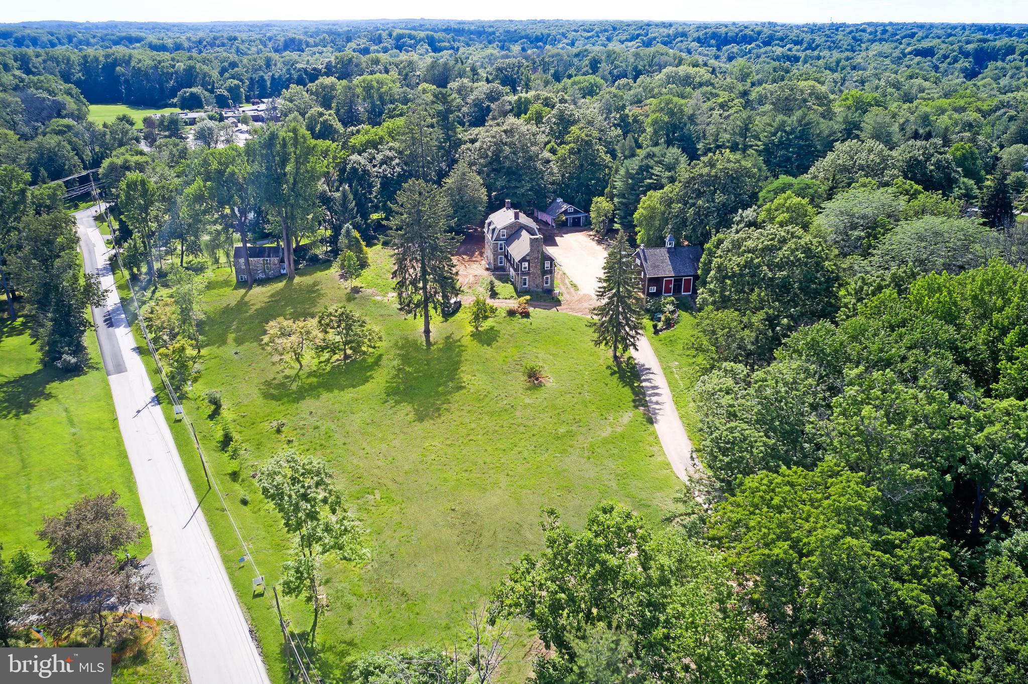Set in the heart of South Devon and within walking distance to the popular Devon Elementary School, Terrain, Anthropologie, and a variety of dining destinations, this 4.6-acre parcel offers both heritage and possibility.
The property carries a township-approved subdivision plan for three parcels—Lot 1 at 2.07 acres, Lot 2 at 1.22 acres, and Lot 3 at 1.47 acres. Each lot is served by public sewer and city gas, with access from Exeter Road, a picturesque neighborhood setting. Finalization of the subdivision is pending .   Alternatively, the land may be enjoyed in its entirety as a single 4.6-acre estate.
Historic elements lend character and provenance. The main house preserves an original stone chimney and reception area, offering an architectural anchor for future construction. A detached early 1900s bank barn—meticulously rebuilt onsite—now serves as a guest residence or party barn, ideal for gatherings and celebrations.  On Lot 3, a recently repointed stone tenant house opens opportunities for expanded living, entertaining, or conversion to a pool house. 
Located within Tredyffrin/Easttown Township, this property combines the convenience of a walkable Devon address with the enduring appeal of historic structures and the flexibility of approved subdivision.