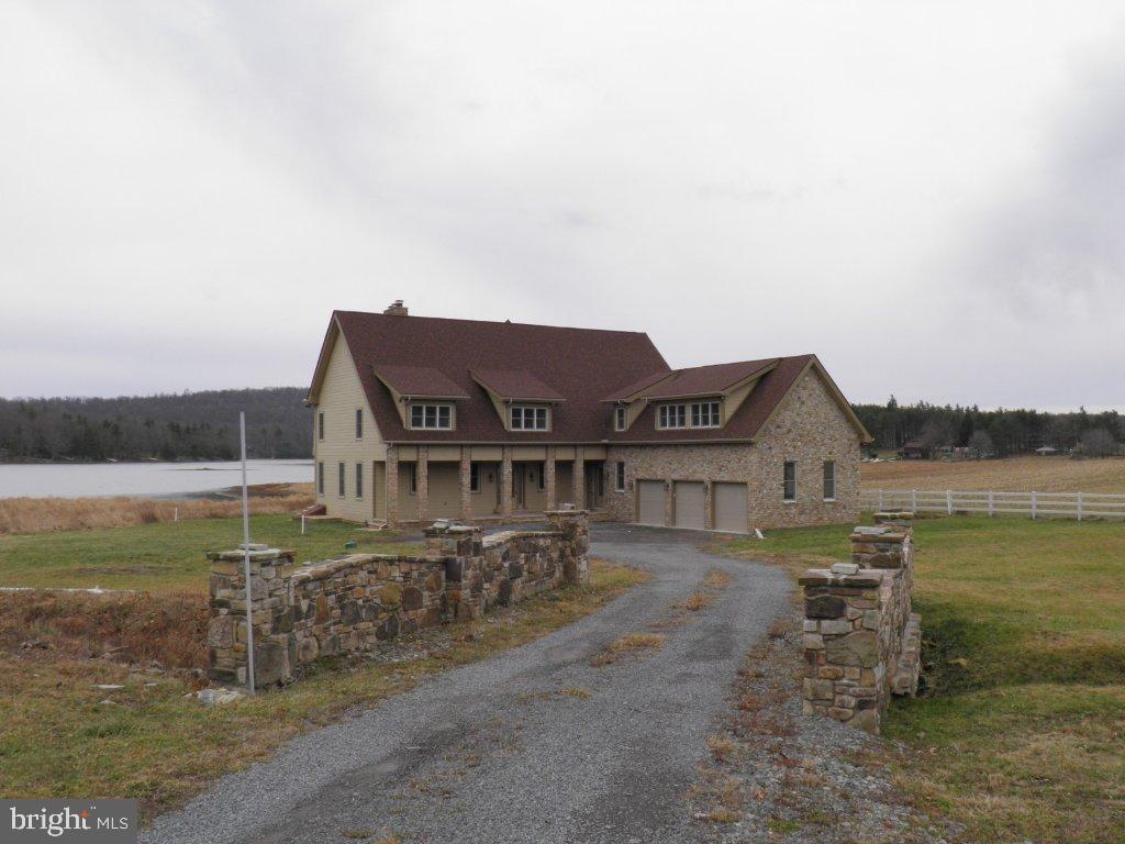 Newly Built Home located on Stilwater Cove Deep Creek Lake, inchludes one slip and accesses over a quarter mile of common shoreline with dedicated beach area. Also Stoned Patio.