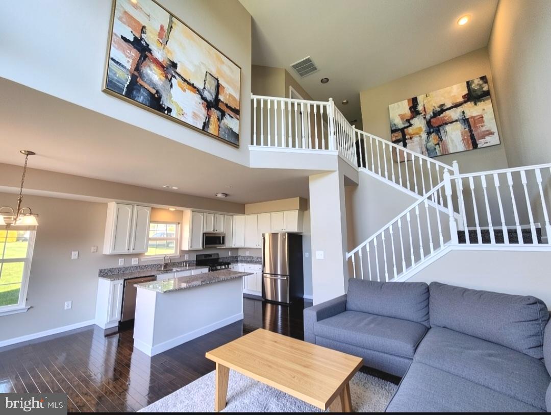 Come fall in love this summer.  Welcome home to this beautifully updated end-unit contemporary townhouse located in the quaint and desirable community of Walnut Ridge! From the moment you enter, you’ll be impressed by the dramatic 23-foot cathedral ceiling in the living room creating an open, bright, and airy atmosphere filled with natural light. Freshly painted throughout and featuring refurbished flooring, this move-in-condition home is ready for its next owner to simply unpack and enjoy. The updated kitchen shines with all-new granite countertops and stylish new fixtures adding a fresh modern touch throughout the home. Enjoy the added privacy and extra natural light that comes with an end-unit location, along with the comfortable contemporary design and easy everyday living this home offers. Conveniently located near shopping, dining, and major commuting routes, this charming Walnut Ridge townhouse is a wonderful opportunity you won’t want to miss!  Maintenance free living.
