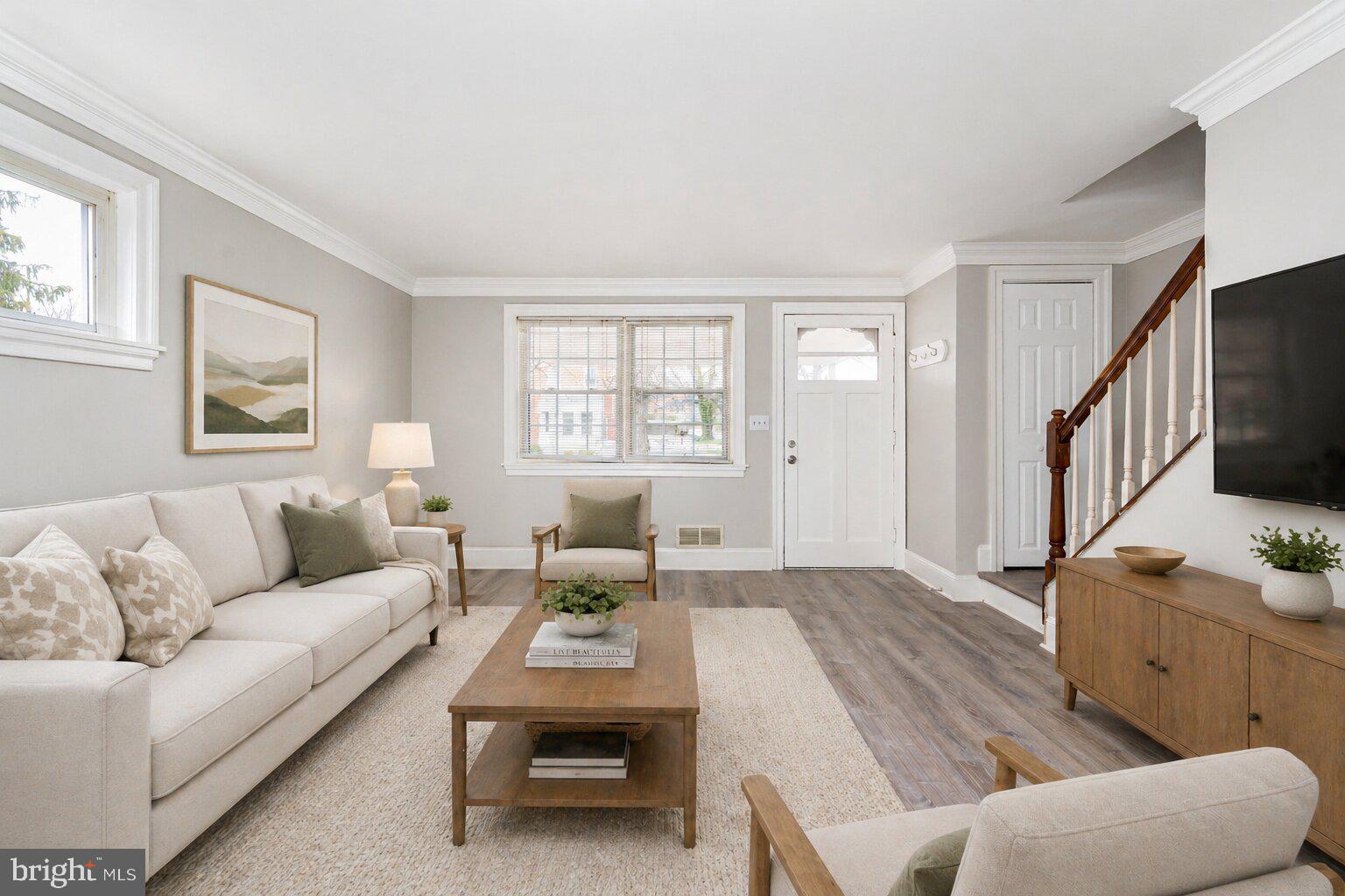 Welcome to this beautifully updated brick-front semi-detached home offering stylish finishes, functional space, and classic charm throughout. Start your mornings with coffee on the covered front porch before stepping inside to find LVP flooring throughout the home. The bright and airy living room features elegant crown molding and provides the perfect space to relax or entertain. Just beyond, the dining room with wainscoting sets the stage for memorable dinners and gatherings. The spacious kitchen is designed for both everyday living and entertaining, complete with abundant cabinetry, generous prep space, quartz countertops, and stainless steel appliances. Upstairs, the spacious primary bedroom offers large closets and crown molding for a polished touch. Two additional bedrooms and a full bathroom with a custom tiled tub/shower combo complete the upper level. The fully finished lower level adds even more living space with a bedroom and a full bathroom featuring a tiled walk-in shower, making it ideal for guests, extended living, or a home office setup. Outside, enjoy the fully fenced backyard, perfect for Summer BBQs, pets, play, or simply unwinding outdoors. Conveniently located near Northern Parkway, Harford Road, Route 1, I-695, and I-95, this home offers easy access to shopping, dining, and commuter routes.