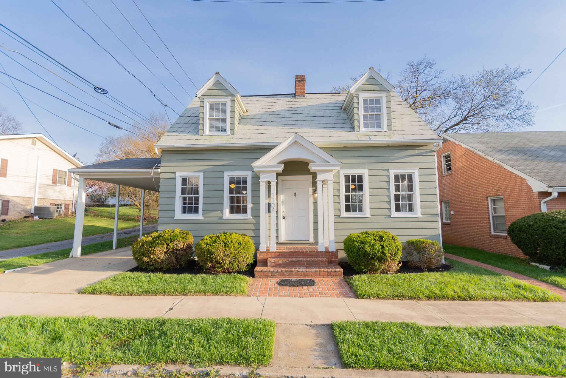 Welcome to this absolutely charming Cape Cod, affectionately known as “The Dollhouse.” From the moment you arrive, it’s easy to see how this home earned its nickname. With its inviting character, cheerful feel, and timeless style, it’s the kind of place that instantly makes you smile.

Step inside and you’re greeted by beautiful hardwood floors that add warmth and elegance throughout the main living spaces. The living room is especially inviting, centered around a gorgeous stone fireplace highlighted by classic wall sconces that create a cozy, welcoming glow in the evenings. It’s the perfect spot to relax with a book, gather with friends, or simply enjoy a quiet night at home.

The kitchen has been thoughtfully updated and is both stylish and practical, featuring granite countertops, upgraded appliances, and recessed lighting that brightens the space beautifully. Whether you’re cooking a quick weekday dinner or hosting friends for the weekend, this kitchen is designed to make everyday living easy and enjoyable.

Outside, the home continues to impress with a fully fenced backyard, offering a private and comfortable space for pets, gardening, outdoor dining, or simply enjoying a little sunshine. It’s the kind of backyard that feels like your own peaceful retreat.

The home also features a full basement, providing excellent storage and plenty of flexibility for hobbies, projects, or future possibilities. Convenient extras such as a washer and dryer and a water softener are already in place, adding even more value and convenience for the next owner.

Everywhere you look, this home feels **bright, happy, and wonderfully welcoming**, with charming details that truly make it stand out. It’s easy to picture yourself settling in and making memories here.

And with all this charm offered at a price that’s sure to attract attention, The Dollhouse is likely to sell quickly. Schedule your showing soon and come experience this sweet and special home for yourself—you just might fall in love.