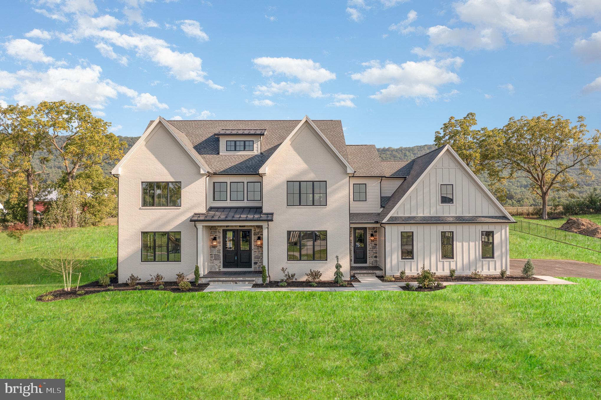 Imagine a home so flawless it feels as though it was crafted just for you—because it was. FoxBuilt  welcomes those who demand nothing less than the extraordinary, those who wish to embrace a lifestyle of unparalleled elegance and bespoke craftsmanship. Introducing 12 Blue Marlin Way, this 5-bedroom, 4-bathroom Modern Farmhouse is situated on a premier 0.92-acre lot in prestigious Glendale Estates within the coveted Cumberland Valley school district, and offers a sophisticated living experience. Step into a world of elegance where every detail has been meticulously crafted. The home features a stunning Modern Farmhouse design with white Hardie plank siding, painted brick, stone accents, and sleek black window frames. The inviting front porch with its herringbone brick pattern and majestic columns sets the tone for the grandeur inside. Enjoy breathtaking views of Blue Mountain from your expansive back patio, ideal for relaxation and entertaining. The grand foyer seamlessly flows into an open-concept living space with wide plank hardwood flooring, exuding warmth and sophistication. The spacious living room is bathed in natural light, creating an inviting ambiance. The gourmet kitchen is a chef's paradise, boasting quartz countertops, high-end appliances, creative custom designs, and  stylish beverage center. The custom range hood and pantry, complete with a coffee bar, make this kitchen both beautiful and practical. Adjacent to the kitchen is an elegant dining room, ideal for hosting memorable dinners. A versatile office/5th bedroom, complete with a walk-in closet and full bath, offers flexibility for your lifestyle needs. The powder room features a unique vanity, adding a touch of charm. The mudroom hallway with its all-brick ceiling and arched wood doors leads to a spacious three-car garage. Ascend to the second floor where luxury and comfort converge. The primary suite is a private retreat featuring a spa-like en-suite bathroom with a wet room shower, two expansive vanities, custom recessed cabinets, and a toilet room with its own additional sink. The master suite also includes a fully stacked walk-in closet, tailored for those who expect the best and finest. Three additional bedrooms, each with access to well-appointed bathrooms, provide comfort and privacy for family and guests. A cozy sitting area and a conveniently located laundry room complete the second floor. The third floor is a versatile space designed to suit your lifestyle needs. The expansive loft area is ideal for a game room, home theater, or additional living space. A utility room provides extra storage, while a well-designed bathroom and functional hall space ensure practicality. The full basement extends your living space, featuring a large recreational area perfect for kids to spread out, play games, or relax. The bonus room is ideal for a home gym or crafting room. Ample storage space, a rough-in for a basement bathroom, and a grand concrete exterior staircase add to the cool basement's appeal. Built with state-of-the-art materials and technology, this home includes Superior Walls foundation, top-shelf well & septic systems, and 400-amp electric service. Smart home technology, separate heating systems, and premium finishes such as custom cabinetry, designer lighting, and hardwood floors sanded and stained on site enhance the home’s appeal. Exterior features include composite trim for low to zero maintenance, a painted brick mailbox that foreshadows quality and luxury within, and an enviable landscape package. If you wish to indulge in a residence that redefines the meaning of perfection and prestige,  where every detail is designed to delight the discerning eye, contact us for your private tour experience. You will not be disappointed.