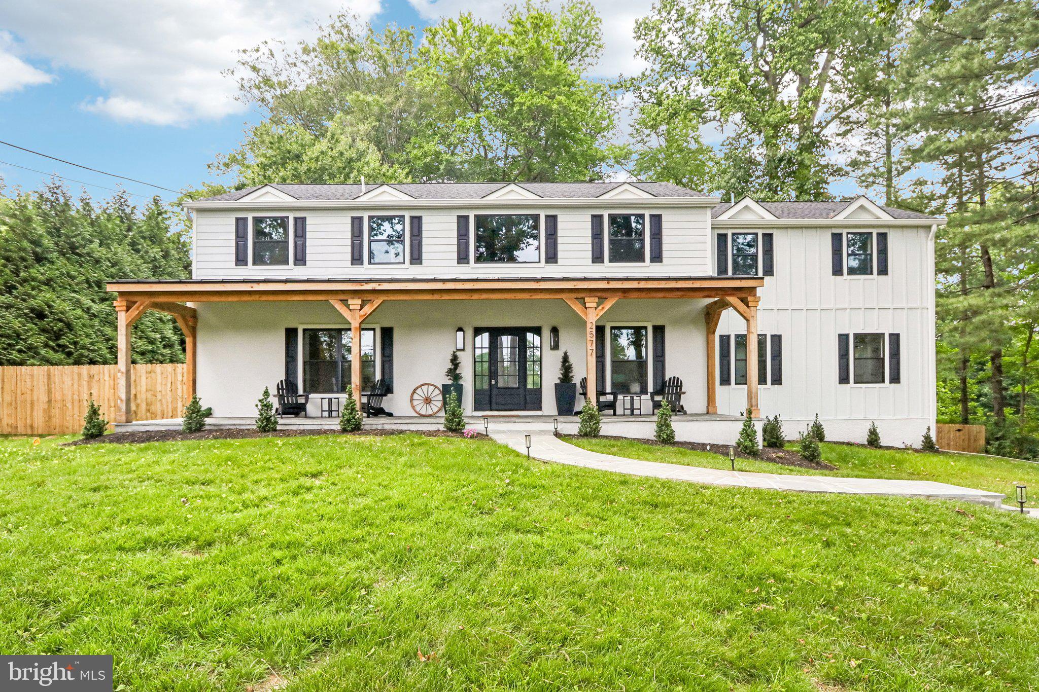 Welcome to 2577 Wayland Rd, a completely renovated and expanded home within top rated Tredyffrin-Easttown School District. Over 5200 of total finished sqft with 6 Bedrooms and 5 Full and 1 Half Bathroom, this property is appointed with the highest end finishes including 9.5" white oak floors, custom cabinetry, hidden oversized Butler's Pantry, extensive millwork throughout, California Closets in every closet of the house, stone clad indoor/outdoor gas fireplace, French iron glass doors, and Restoration Hardware lighting throughout. Situated on a one acre flat lot with fully fenced in yard, this house exudes curb appeal with its cozy front porch and mature landscaping. Enter through the wrought iron front door to find a grand two-story entranceway with herringbone pattern floors and custom iron railings. The main floor boasts an open kitchen with custom shaker cabinetry, a hidden pantry offering additional storage, a wine fridge and access to the dining room making this space ideal for entertaining and everyday use. The Sub-Zero fridge and two Bosch dishwashers are paneled to blend seamlessly while the 48" Wolf range is a chef's dream. An oversized 12' kitchen island with Calacatta Castana quartz waterfall edge overlooks the expansive living room with coffered ceiling, a stone-clad gas fireplace and two sets of California style folding doors that open to a generously sized deck. The main floor also features a formal dining room, breakfast nook, half bath and additional living room (with a full bath and walk-in closet and can easily be a 6th main floor bedroom). Upstairs you will find five bedrooms and four full bathrooms. The house features a generously sized Primary Suite with His and Hers walk-in closets and an all marble ensuite with a soaking tub, dual sink vanity, and oversized double head shower. Rounding out the house is a fully finished basement with herringbone brick flooring in mud room along with built-in bench and storage. The rest of the basement features a fully finished family room with wide plank flooring and a bonus space perfect for a home gym. 25777 Wayland Rd is ideally located - steps to Episcopal Academy, minutes to other top private academies, and close to the Paoli train station and the shopping/dining options in Newtown Square, Wayne and KOP. Offering the rare opportunity to enjoy luxury, and convenience in one of the Main Line’s most desirable locations- Call today for more information; this property is not to be missed!