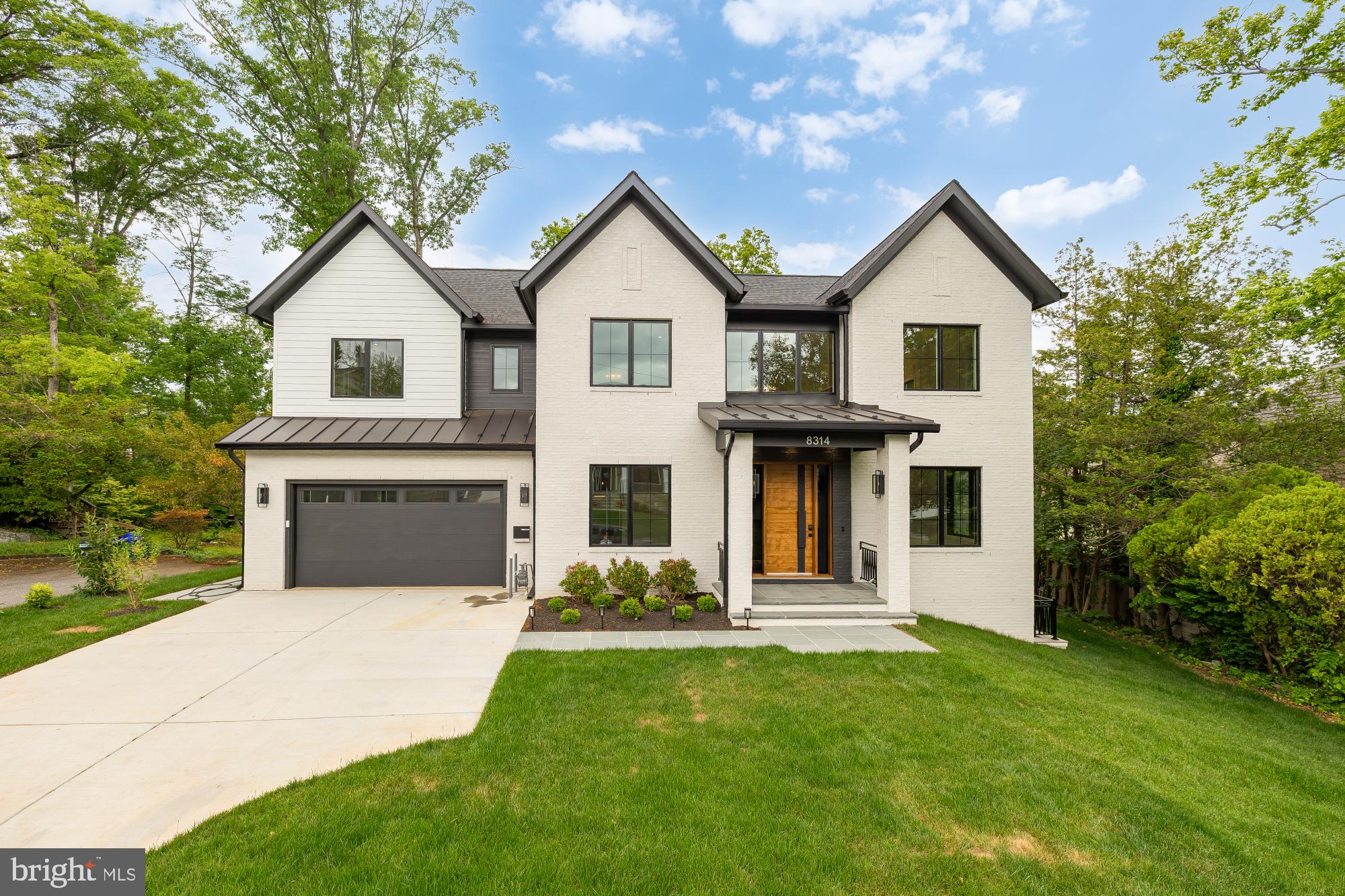 Welcome to 8314 Thoreau Drive, a beautiful new construction home set on one of the most picturesque streets in Woodhaven, one of Bethesda’s most sought-after neighborhoods, within the Walt Whitman High School district. This thoughtfully designed residence offers exceptional scale, flexibility, and everyday luxury, with 6 bedrooms plus a gym and a spacious bonus room ideal for a home theater, playroom, office, or potential 7th bedroom. A bedroom and full bath on the main level provide the perfect setup for guests, au pair living, or multigenerational living. The home is elevator-ready for future convenience, while the walk-out lower level adds natural flow to outdoor living and entertaining. Complete with a large lot and rare 3-car garage, this is a standout Bethesda new build offering the location, layout, and lifestyle buyers are looking for.