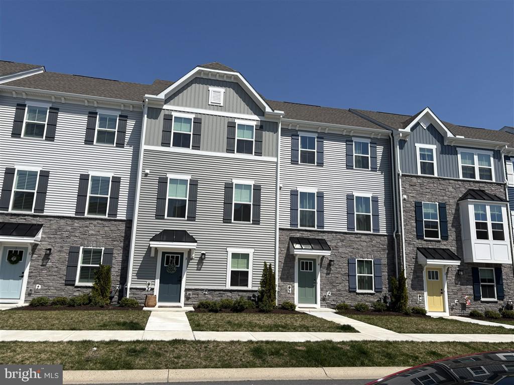 Stunning Nearly-New 4-Story Townhome | 2,765Sq Ft | Designer Interiors Welcome home to this beautifully appointed, nearly new four-story townhouse offering approximately 2,765 square feet of thoughtfully designed living space. With 4 spacious bedrooms, 3 full baths, and 1 half bath, this home combines modern comfort with elevated style. Still under warranty! Professionally decorated by an interior designer, every level showcases curated finishes, cohesive color palettes, and high-end details that make the space feel both sophisticated and inviting. The open-concept living areas are perfect for entertaining, while the multiple levels provide flexibility for work, relaxation, and privacy. Highlights include: • Expansive 4-story layout with abundant natural light • Designer-selected furnishings and décor throughout. Includes $14,000 Hunter Douglas Woven Wood Shades with lifetime warranty. • Generous primary suite and well-proportioned secondary bedrooms • Modern kitchen and living spaces ideal for hosting • Less than one year old — move-in ready in impeccable condition Rooftop deck with views of Assateague Island and the Atlantic Ocean. Loads of community amenities to enjoy the next phase of your life. Kayak launch, crabbing pier, tennis, pickleball and basketball courts, picnic areas, walking trails, Clubhouse with fitness center, and indoor & outdoor pools. Furnishings may be available for purchase at an additional cost, offering a turnkey opportunity for buyers who appreciate the current aesthetic. (Some furniture pieces and artwork will be excluded.) This is a rare opportunity to own a like-new, professionally styled home without the wait. Schedule your showing today.