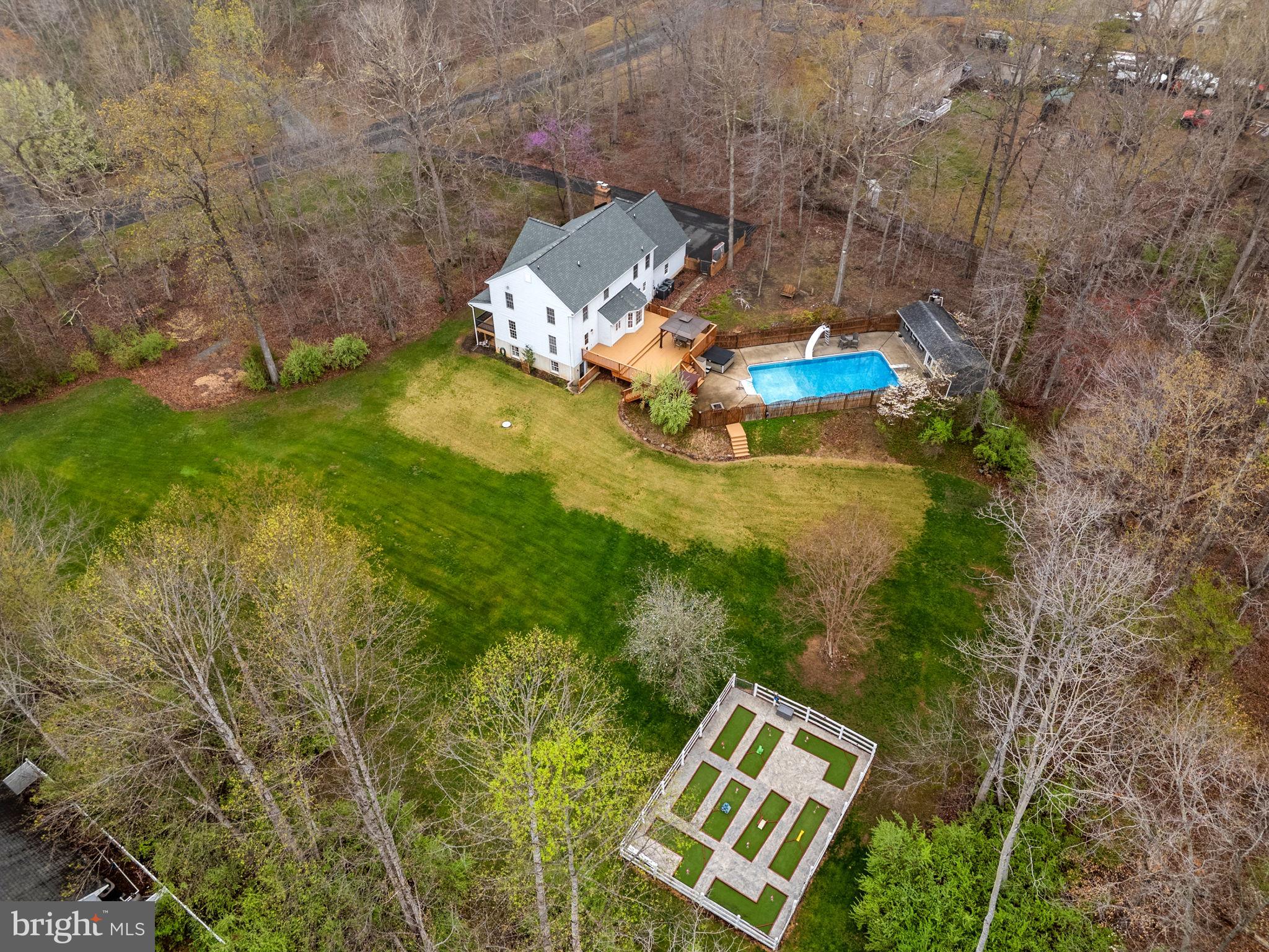 Nestled on a beautifully wooded lot in the sought-after Quail Ridge community of Amissville, this inviting Colonial offers a perfect blend of comfort, recreation, and natural surroundings. With 4 bedrooms and 3 full bathrooms, the home provides flexible living spaces designed for everyday living and entertaining alike.

The recently remodeled kitchen features modern finishes and thoughtful design, creating a welcoming space for gathering and meal preparation. The updated primary bath offers a relaxing retreat with stylish upgrades and a spa-like feel.

Step outside and discover an array of exceptional outdoor amenities. The in-ground pool, hot tub, and sauna create a private oasis ideal for relaxation and entertaining. Adding to the unique appeal, the property also features a charming 9-hole putt-putt golf course—perfect for outdoor fun and leisure. Add in the large yard and fenced in pet area and what else could you want? 

Surrounded by mature trees, the property offers a peaceful setting while still being conveniently located near the amenities of Warrenton, including local shops, dining, and services. Outdoor enthusiasts will appreciate the proximity to wineries, scenic drives, and recreational opportunities throughout Culpeper County and nearby parks.

This property presents a wonderful opportunity to enjoy a blend of privacy, recreation, and convenience in a desirable location.