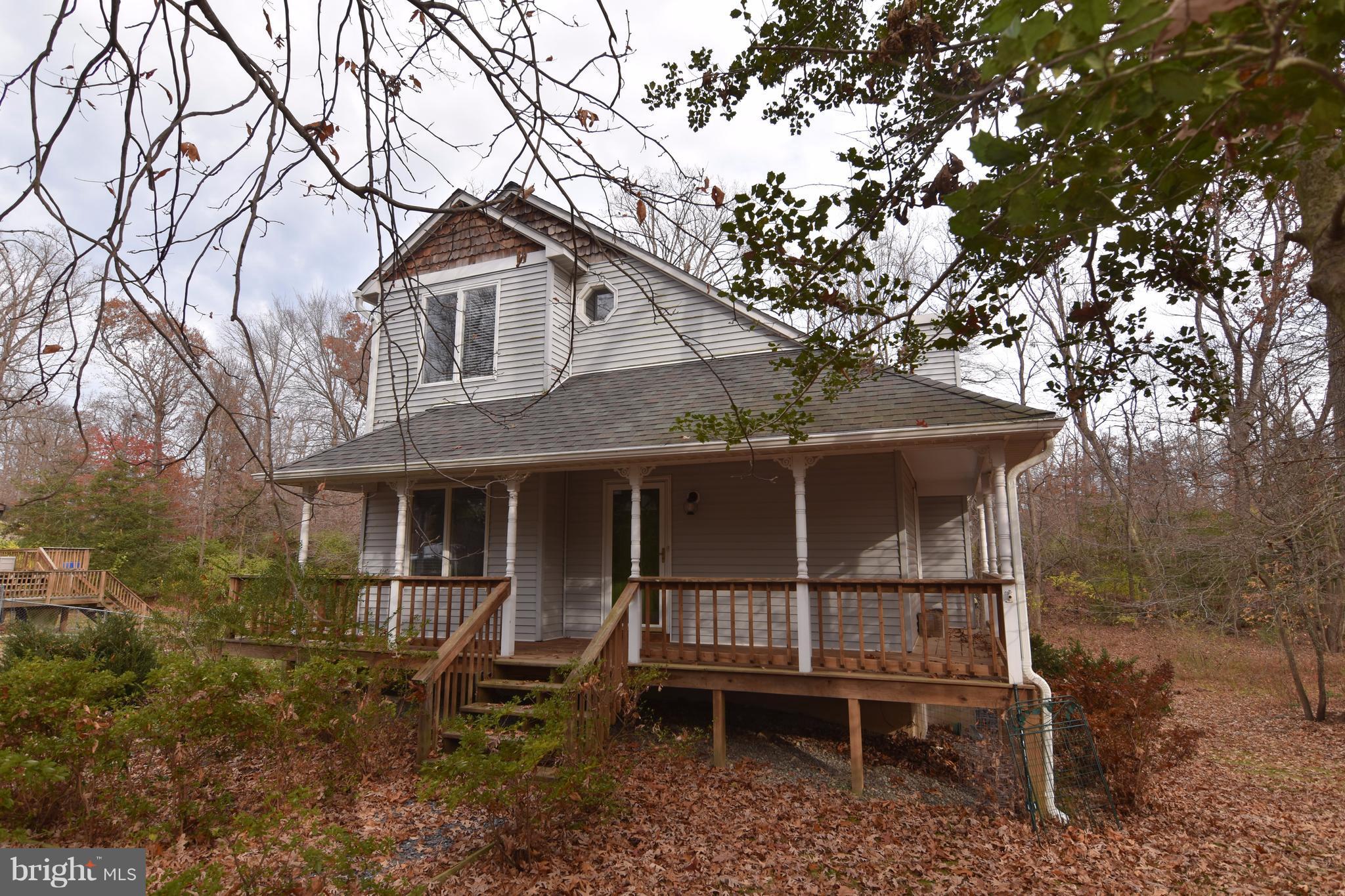 Contemporary home with open floor plan.  Large great room with fireplace.  First floor bedroom and bath.  Kitchen with french doors to deck and gazebo.  Finished basement with family/game room and 3rd full bath.  Roof and HVAC replaced in 2009.