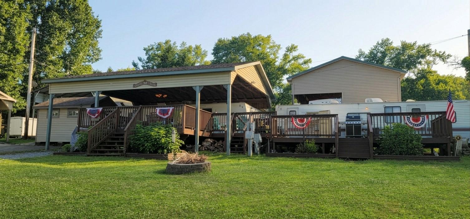 Double the Fun! Escape the city hustle to your own private double-lot retreat at Riverbend Park. This unique setup features two spacious lots and two campers, perfectly configured for hosting family, grandkids, or friends. The Main Suite (2004): Features a private master bedroom, a dedicated bunk room for the kids, a full bath with a tub, and a spacious living area that converts for extra guests. The Bunk House (1997): Recently updated and reimagined as a guest sanctuary! It offers two private sleeping areas, a large living space with ample storage, and its own bathroom with a walk-in shower. Outdoor Living: Relax on the massive deck spanning nearly the length of both units, or cool off under the custom pavilion. The entire deck is gated, so your dogs can roam safely and freely. Riverbend is a premier 400-acre seasonal community (April–Nov) along 10 acres of the Potomac River. Whether you’re into boating and fishing or prefer the community pools, car shows, and onsite dining, there is something here for everyone. Just 90 minutes from DC/NOVA, but a world away!
